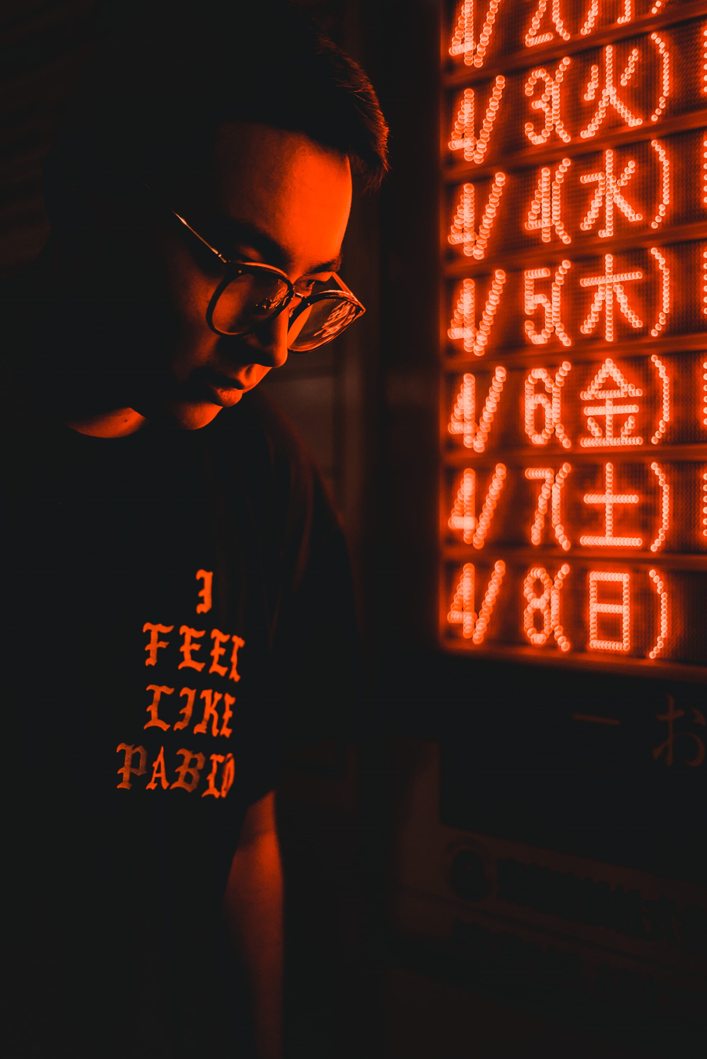 real people, light, reflection, men, kanye west, headshot, signage, man, led, night, standing, person, low light photography, indoors, red, adult, near, Phone HD Wallpaper