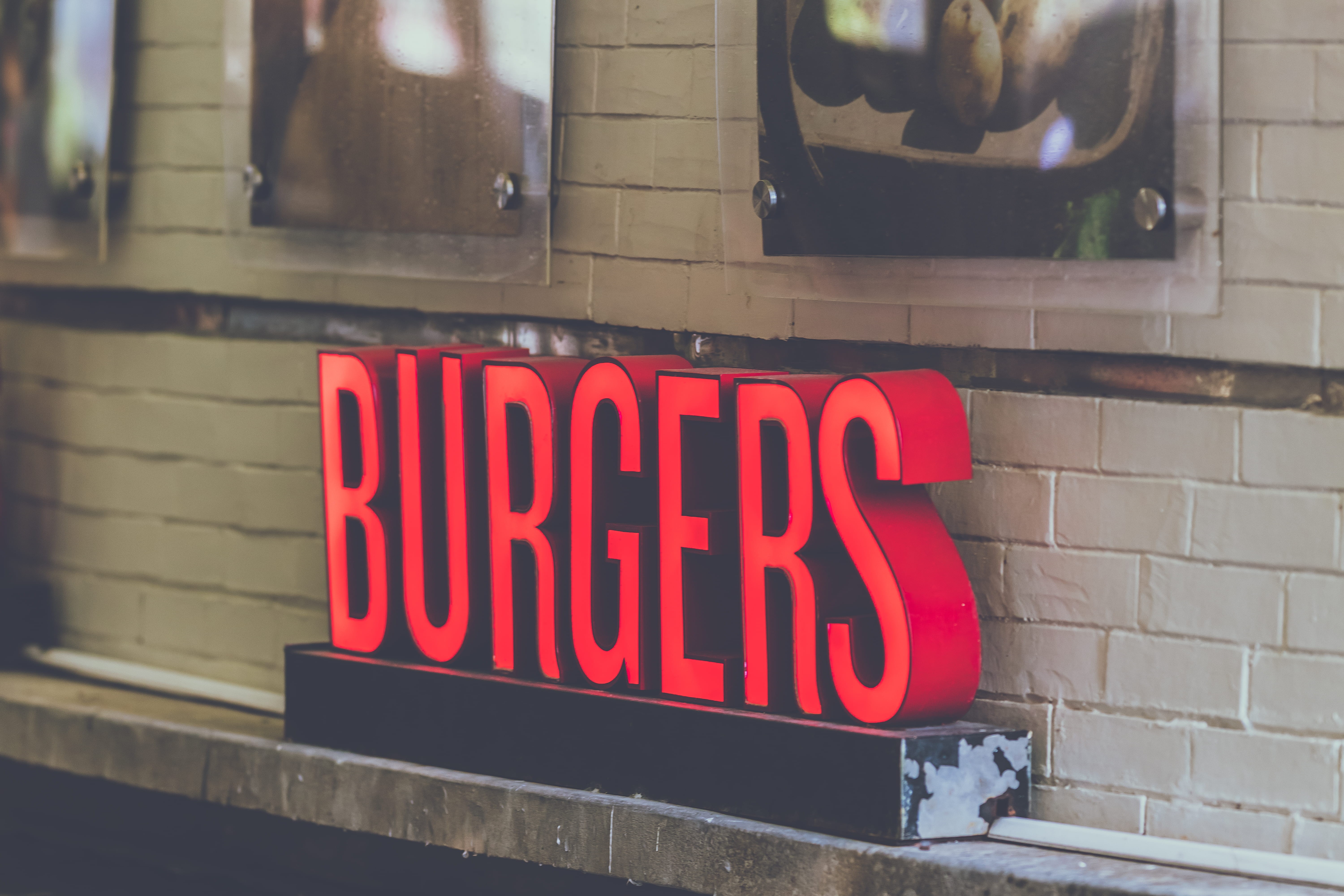 signage, day, words, transparent, western script, burger, advertising, outdoors, built structure, sign, brick, style, text, architecture, window, no people, HD Wallpaper