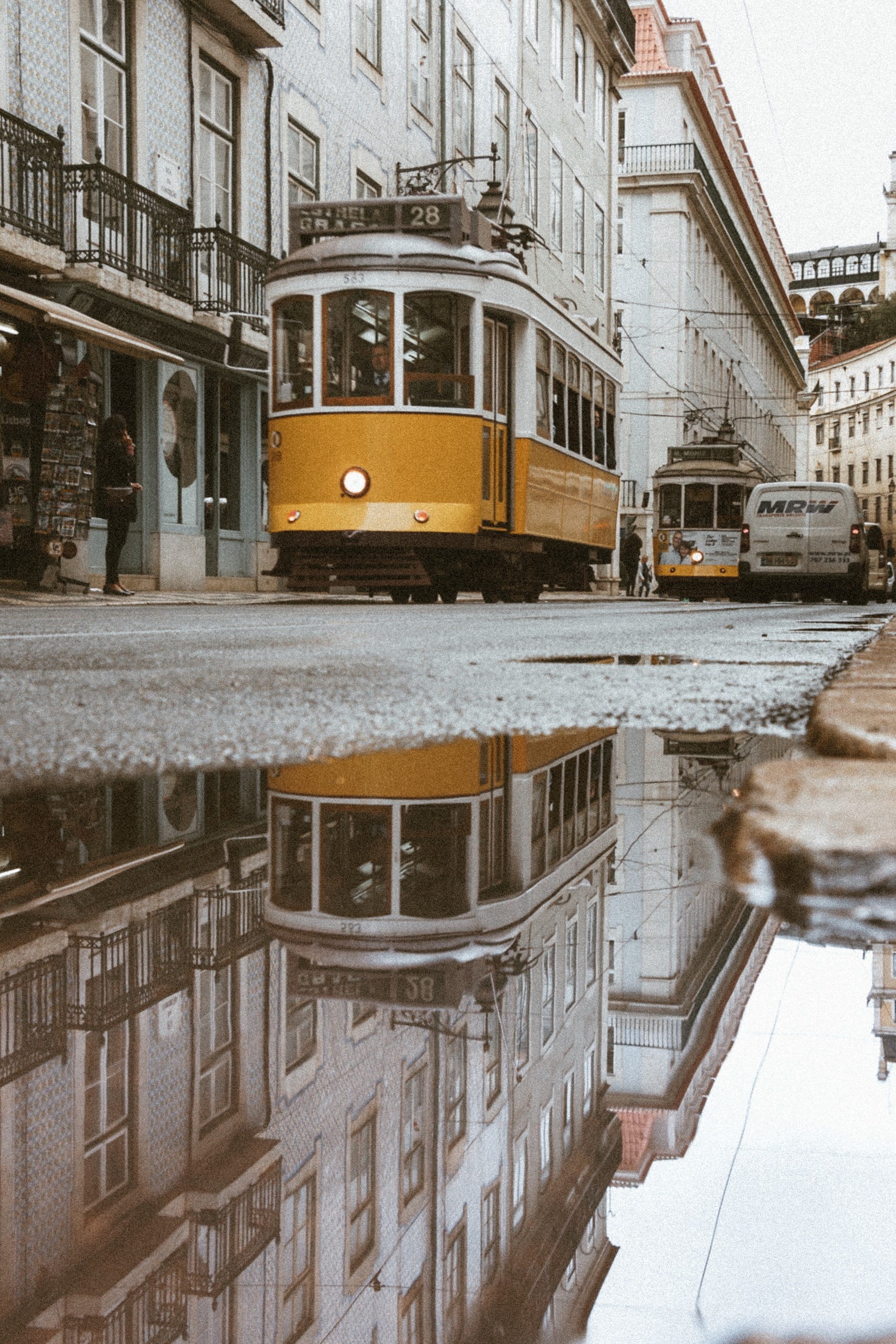 canal, public transportation, 2K, rail transportation, building exterior, man, bus, puddle, reflection, building, city, tram, cable car, driving, built structure, Phone HD Wallpaper