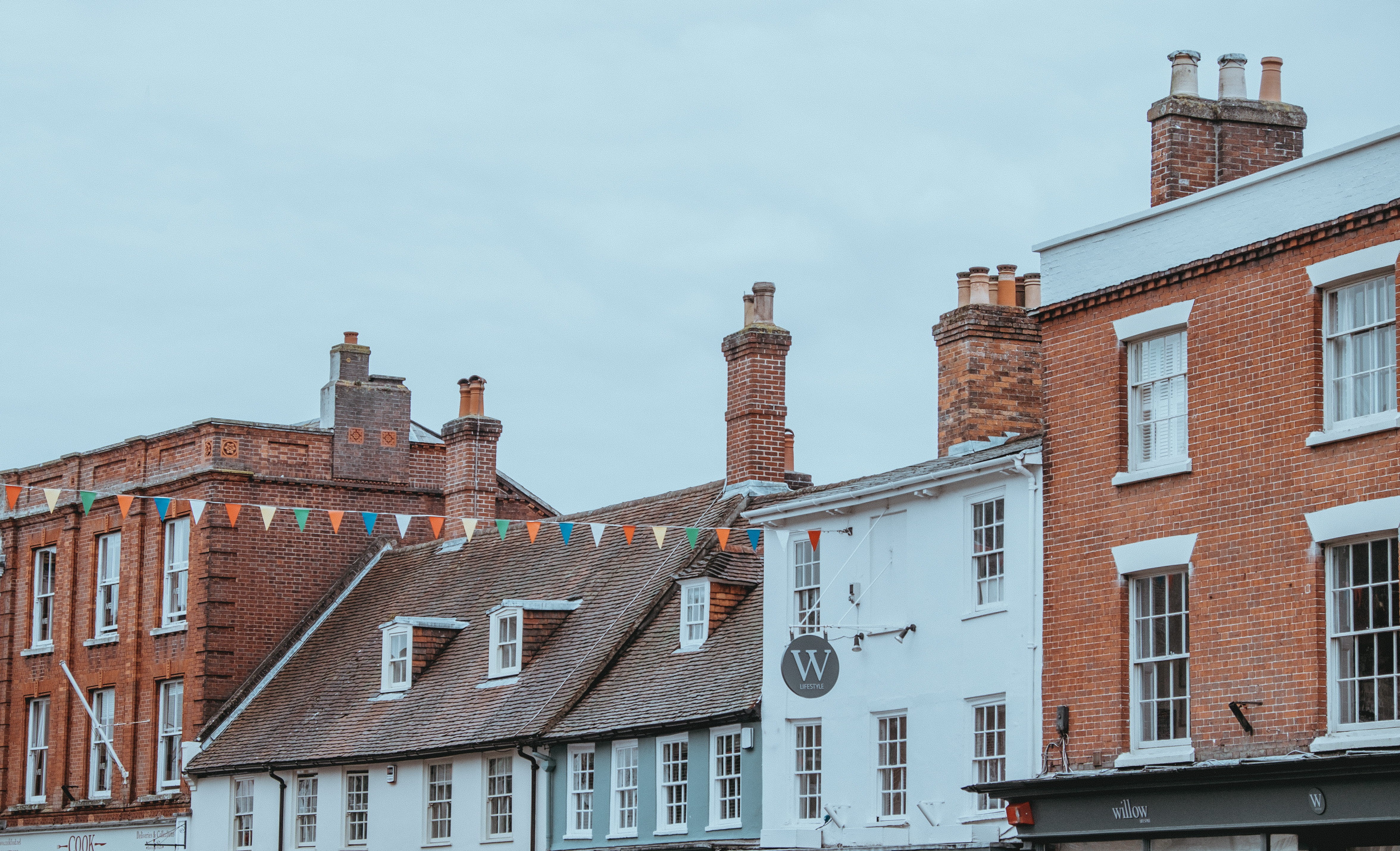 brown, brick, blue, white, bunting, hanging, facade, architecture, buildings, building exterior, communication, window, flaglet, brick wall, blue sky, multicolored, HD Wallpaper