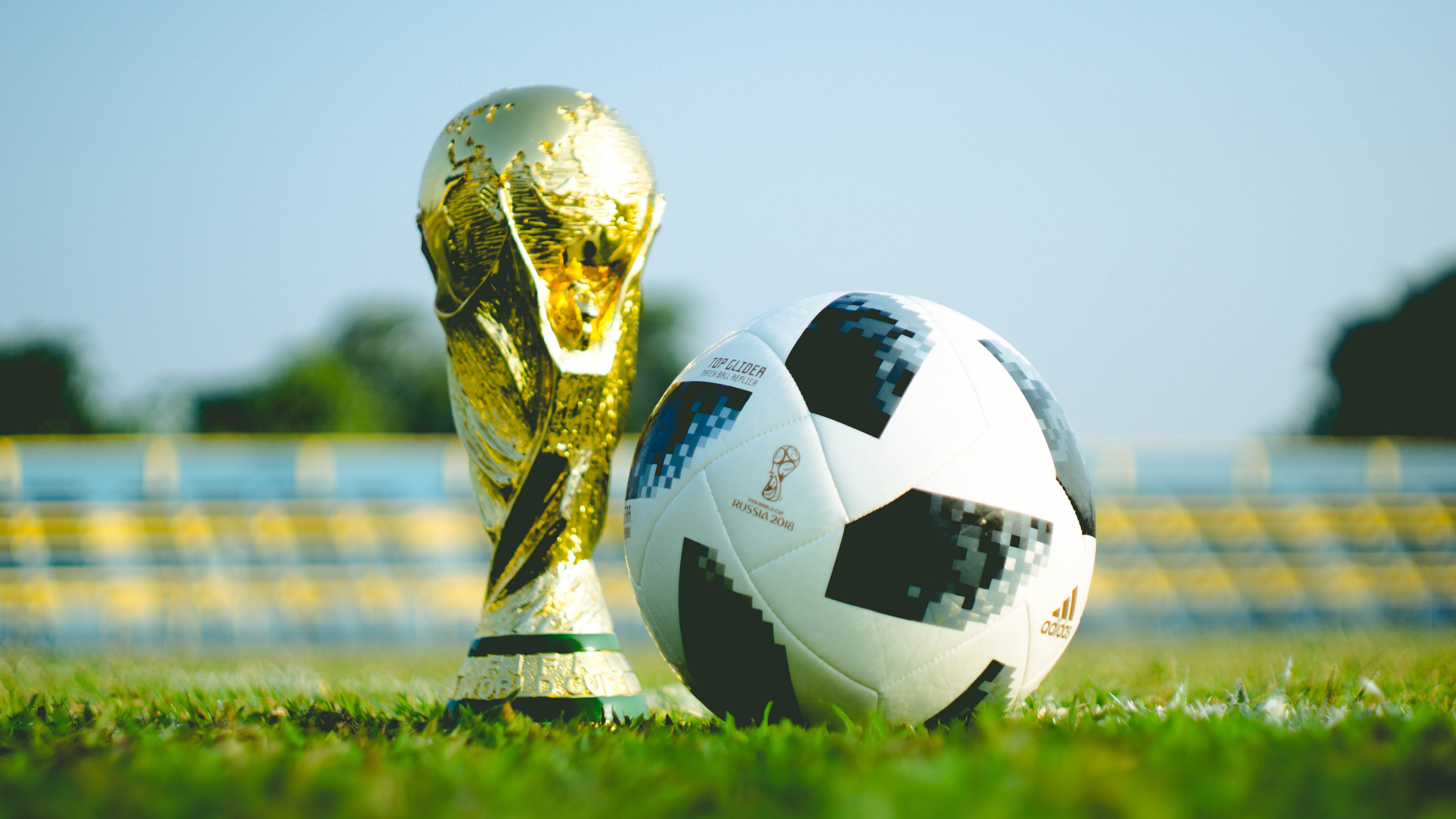 outdoors, ball, football, soccer field, close-up, plant, sports equipment, trophy, world cup, day, nature, focus on foreground, helmet, adida, colored, HD Wallpaper