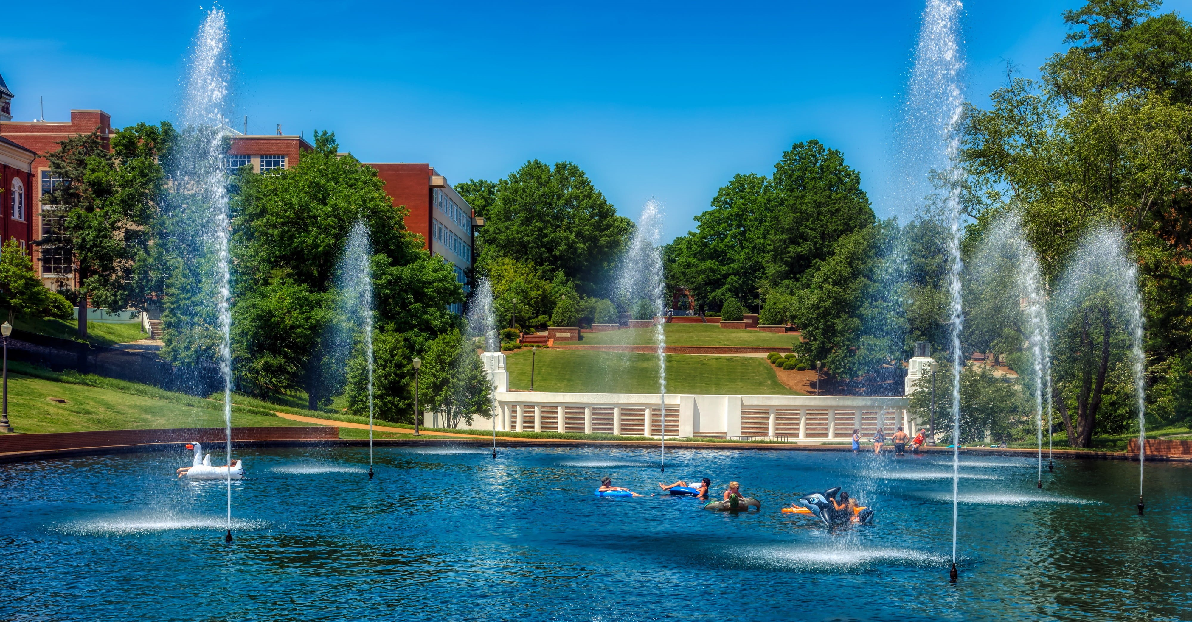 day, landscape, spraying, school, sky, real people, building exterior, plant, tree, frolic, swimming pool, group of people, campus, panorama, architecture, HD Wallpaper
