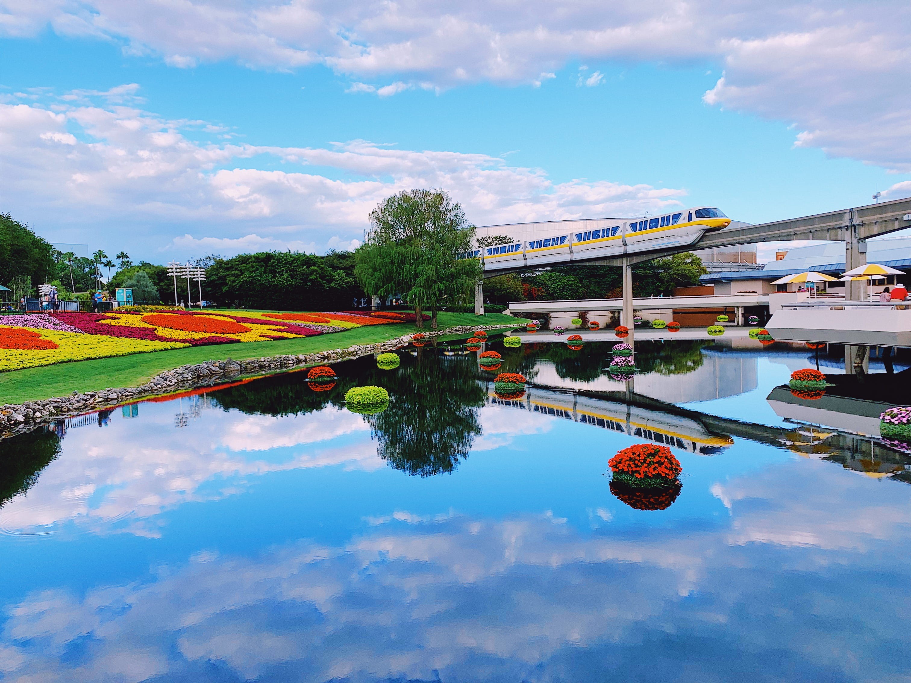no people, railway, fun, sky, city, 2K, garcesbros, building exterior, water, blueskies, tree, built structure, architecture, transportation, disney, reflection, HD Wallpaper