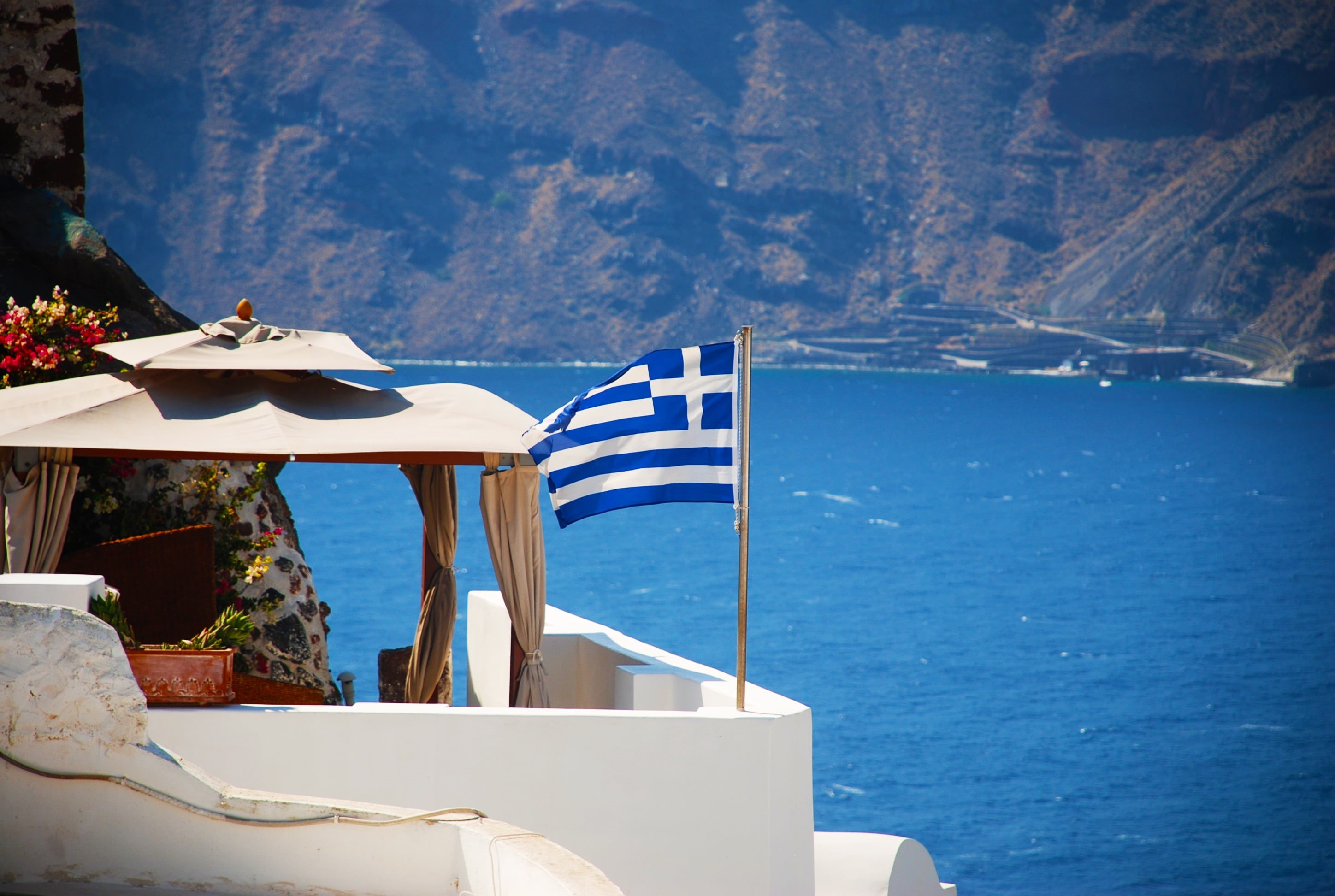 daytime, tent, mediterranean, tourism, built structure, cyclades, 2K, oia, near, patriotism, house, sunlight, architecture, santorini, greek, nautical vessel, HD Wallpaper