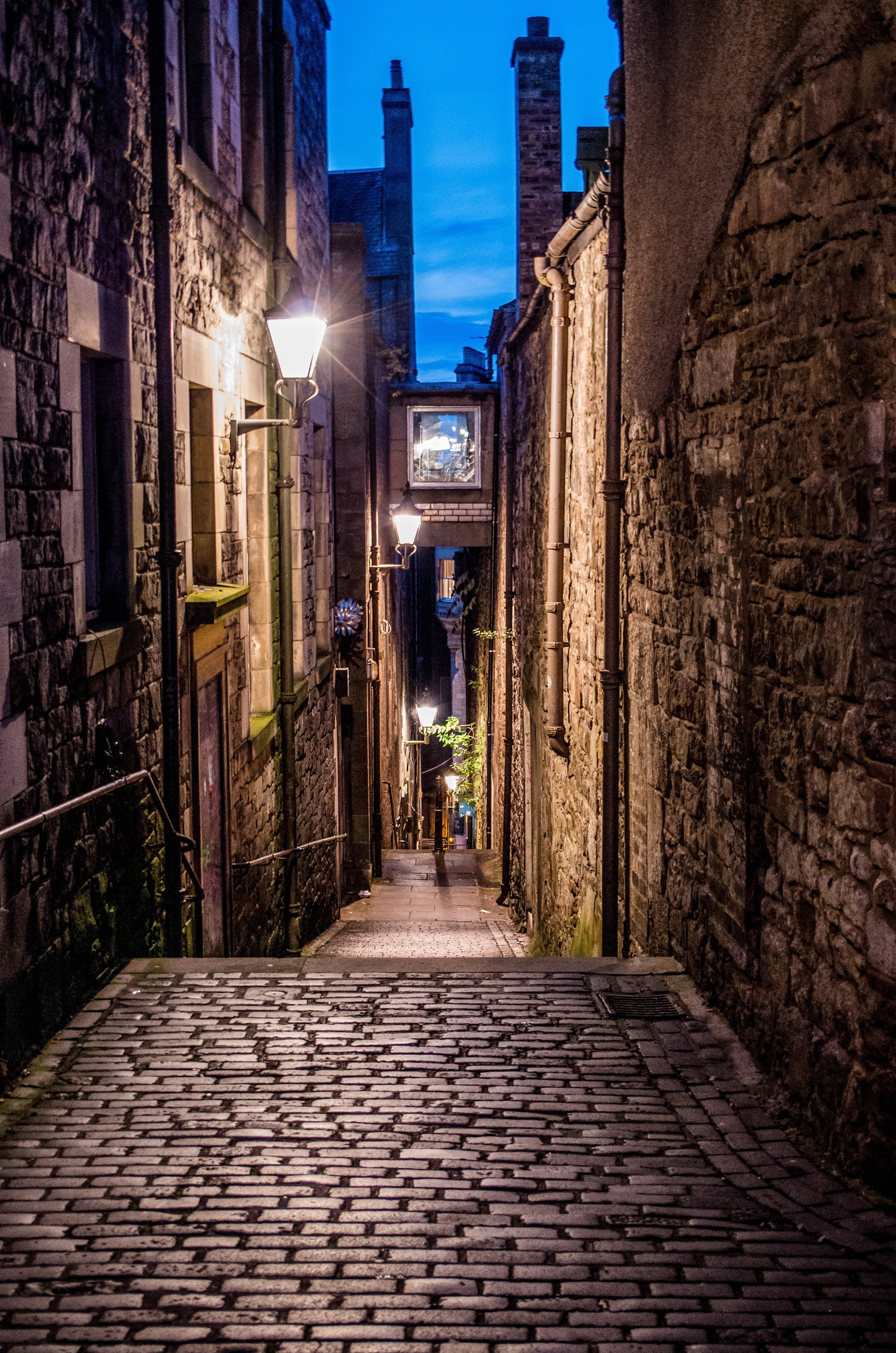 cobblestones, paving stones, paving stone, outdoors, night, travel destinations, real people, lighting equipment, one person, building exterior, anchor close, Phone HD Wallpaper