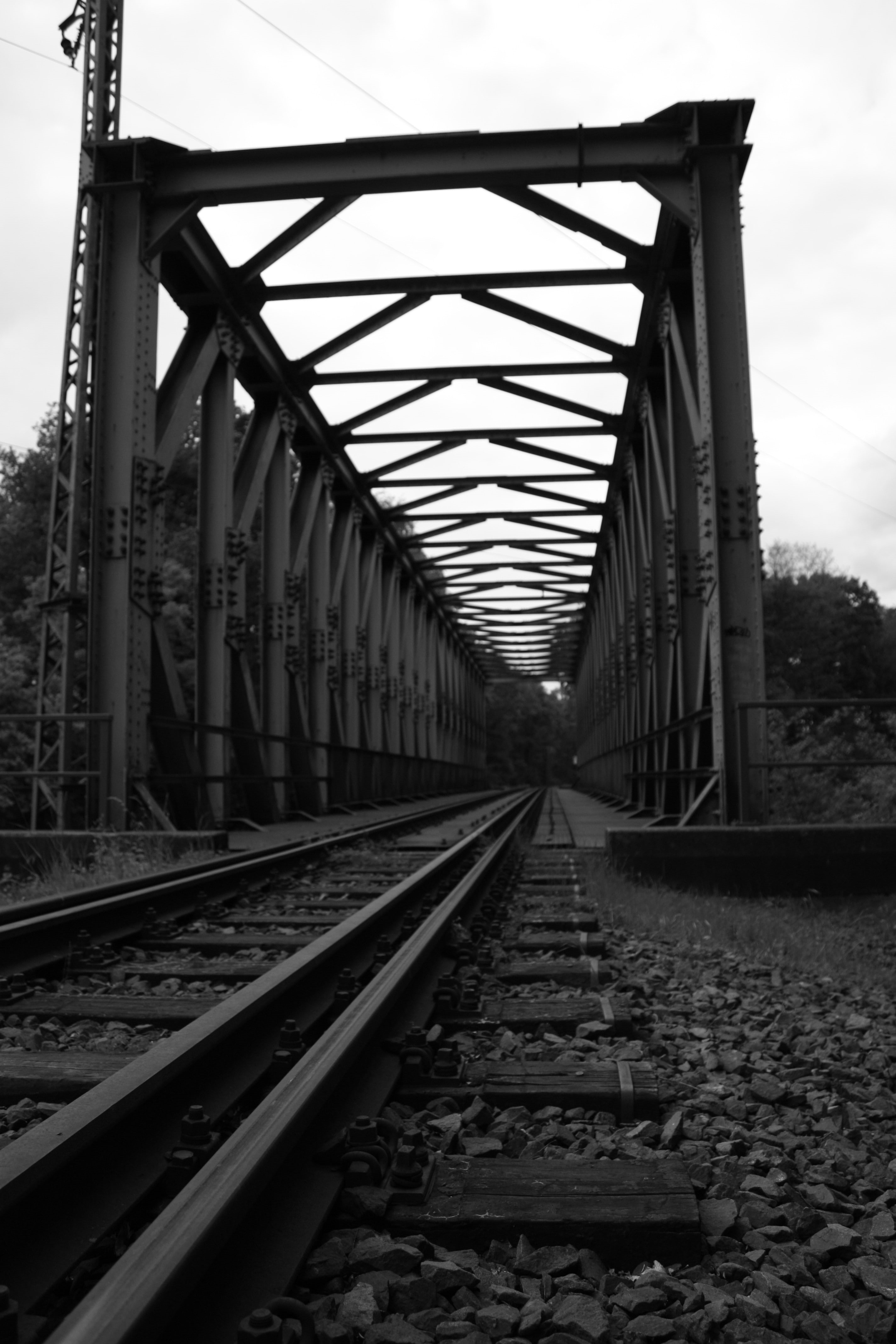 monochrome, metal, built structure, railroad track, day, iron - metal, direction, 4K, diminishing perspective, the way forward, straight, nature, sky, Phone HD Wallpaper