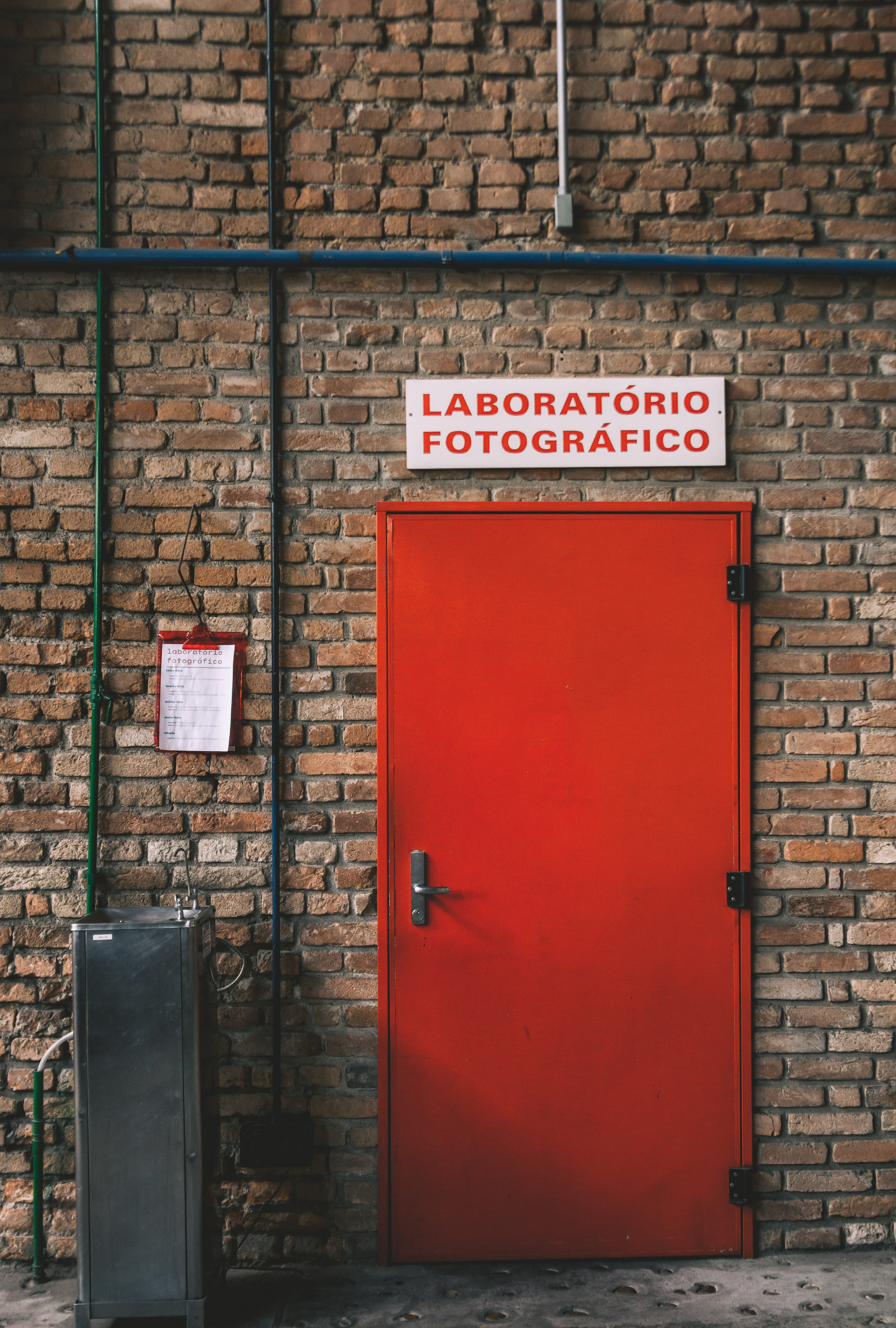 brick, brick wall, wall - building feature, safety, sign, clipboard, door, security, pipes, 5K, fountain, colorful, bricks, minimalistic, minimal, wall, Phone HD Wallpaper