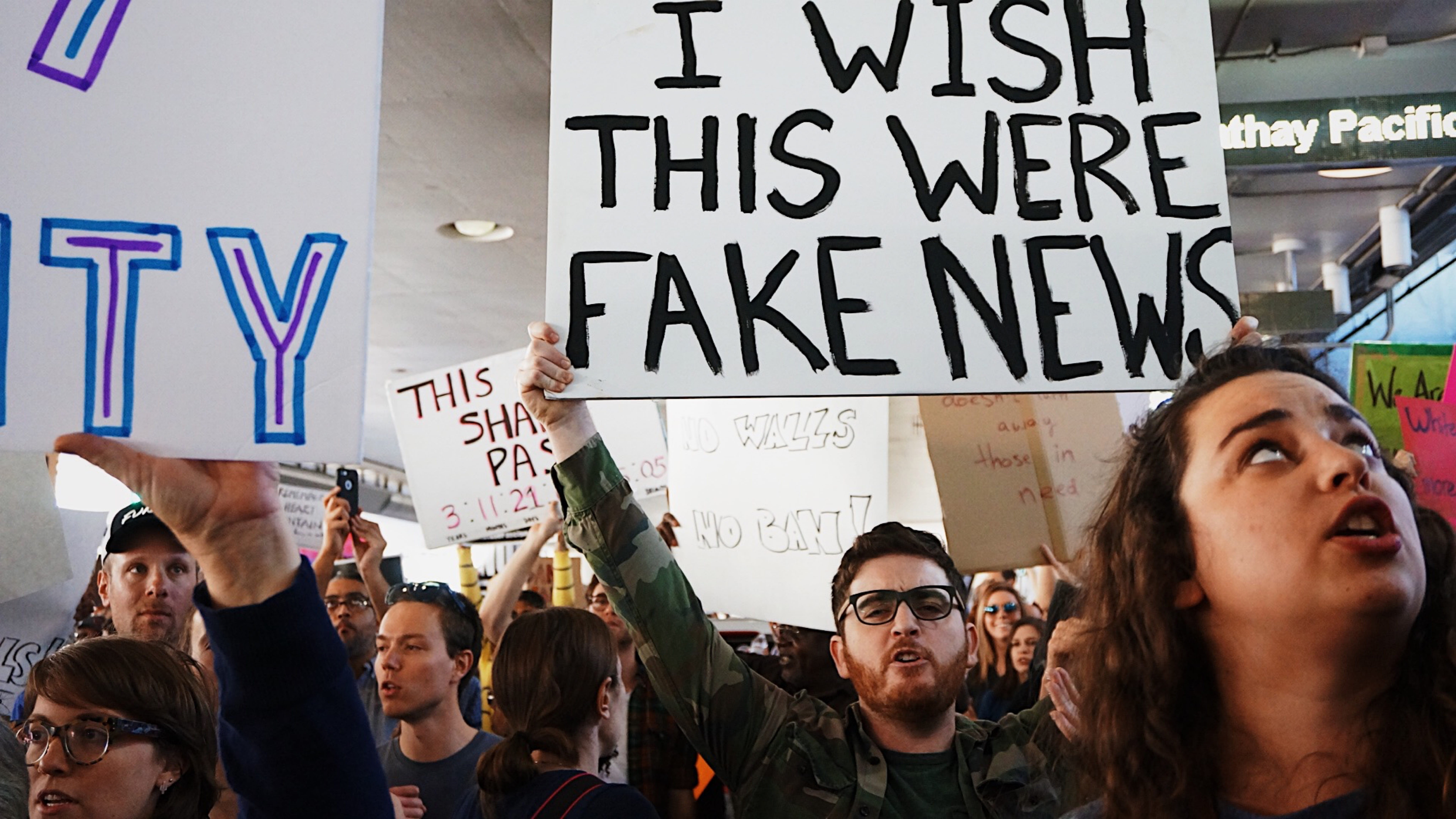holding, activist, arms raised, placard, message, conflict, real people, political Rally, negative emotion, crowd, posters, government, social issues, group of people, HD Wallpaper