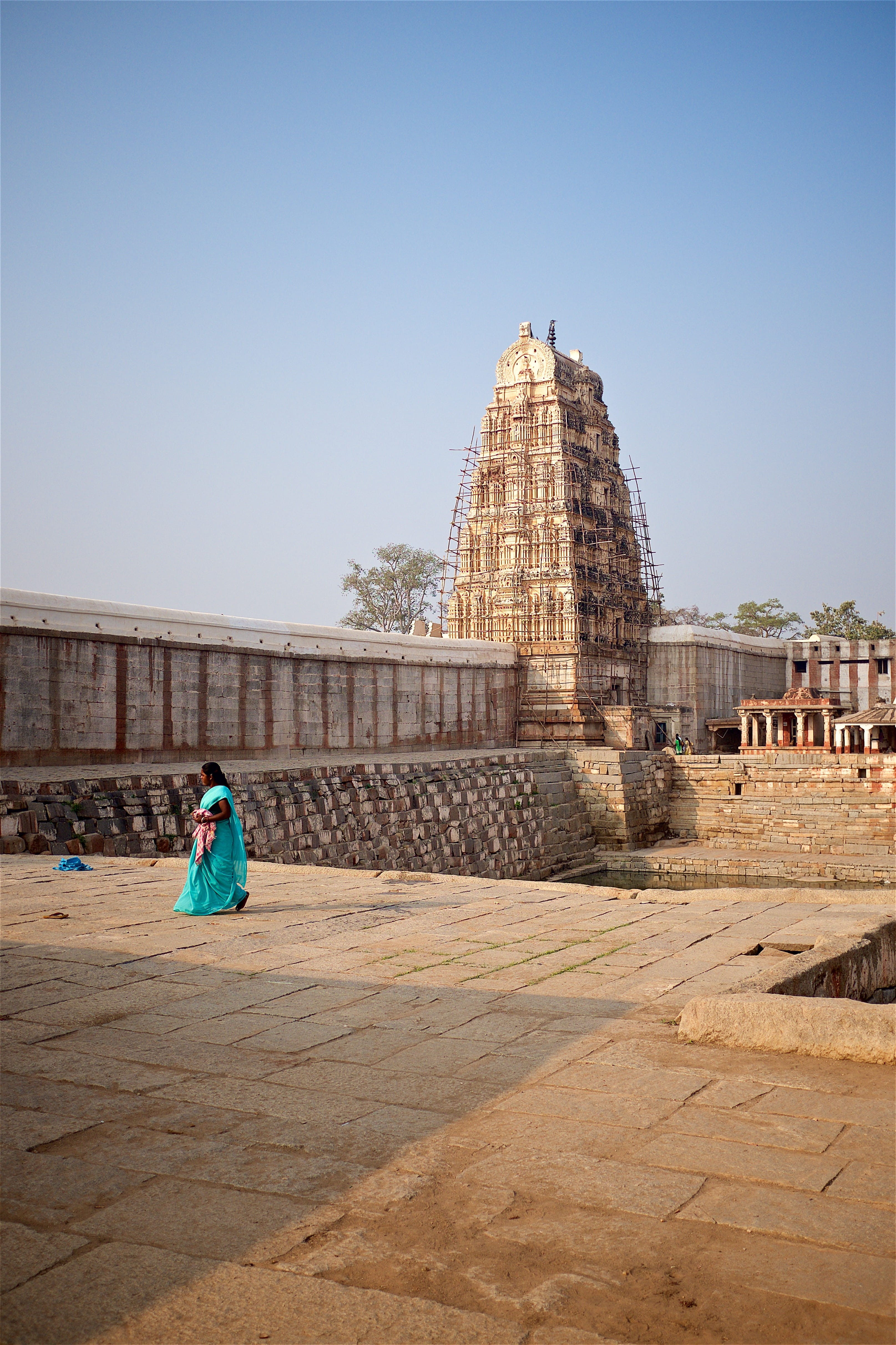 temple, travel destinations, architecture, hampi, tourism, rear view, wash, india, building, ancient civilization, archaeology, construction, real people, Phone HD Wallpaper