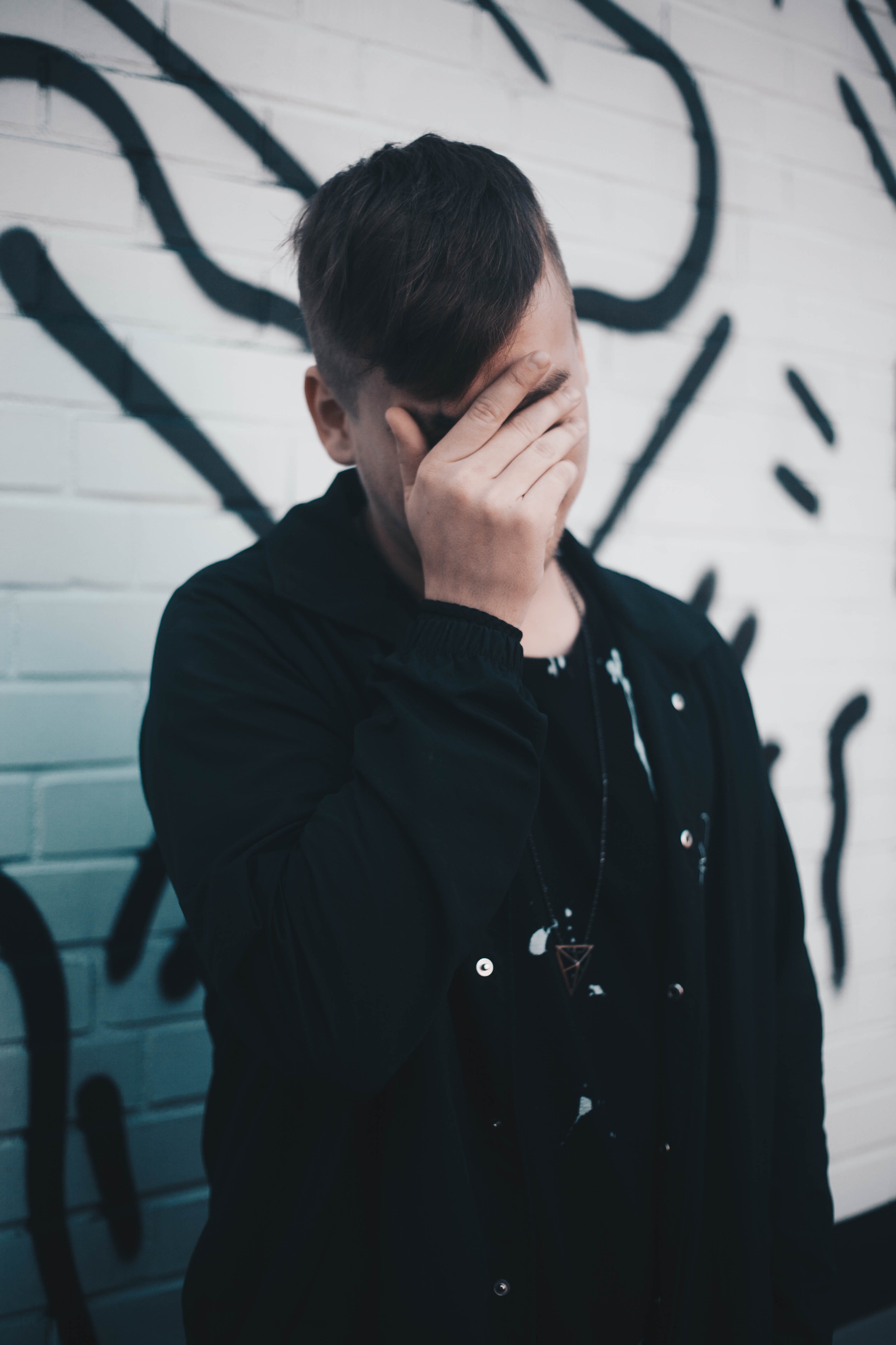 waist up, contemplation, male, black color, man, lifestyles, looking, covering, leisure activity, one person, face, touching, casual clothing, standing, Phone HD Wallpaper