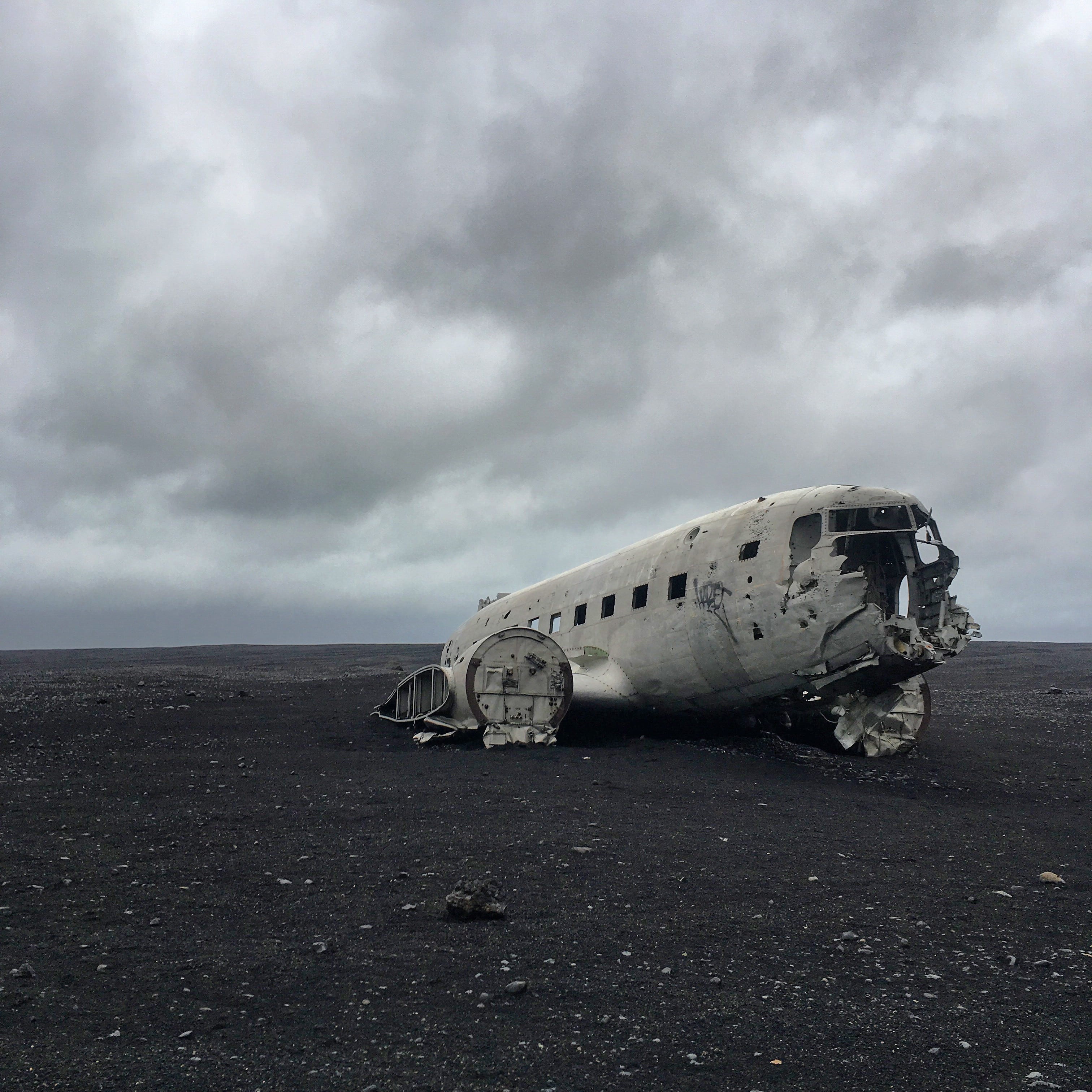 mode of transportation, wrecked, daytime, air vehicle, gray, gravel, ruined, iceland, sky, deterioration, land, travel, nature, overcast, no people, beach, Phone HD Wallpaper