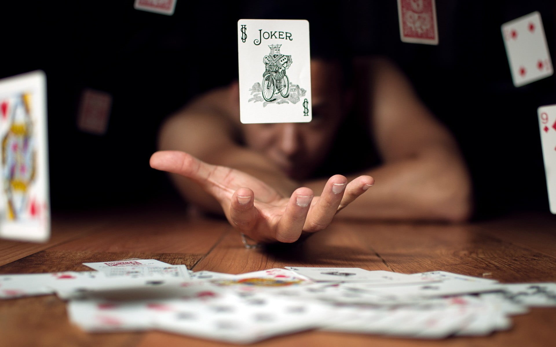 technology, holding, indoors, lot, cards, computer, one person, hand, paper, finger, table, communication, selective focus, men, wireless technology, 1080P, HD Wallpaper