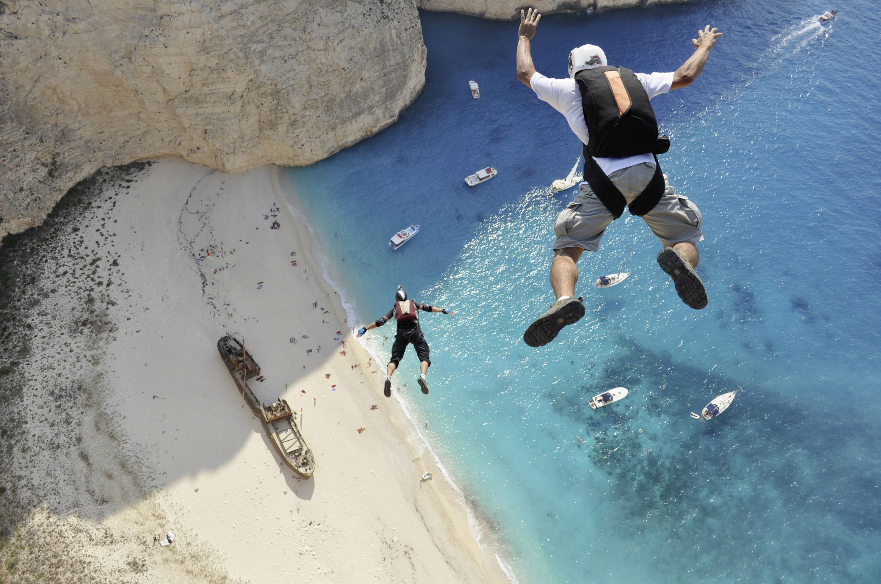 skydiving, sunlight, two people, sports, sand, men, 2K, people, parachutes, swimming, Greece, nature, outdoors, land, real people, birds eye view, helmet, HD Wallpaper