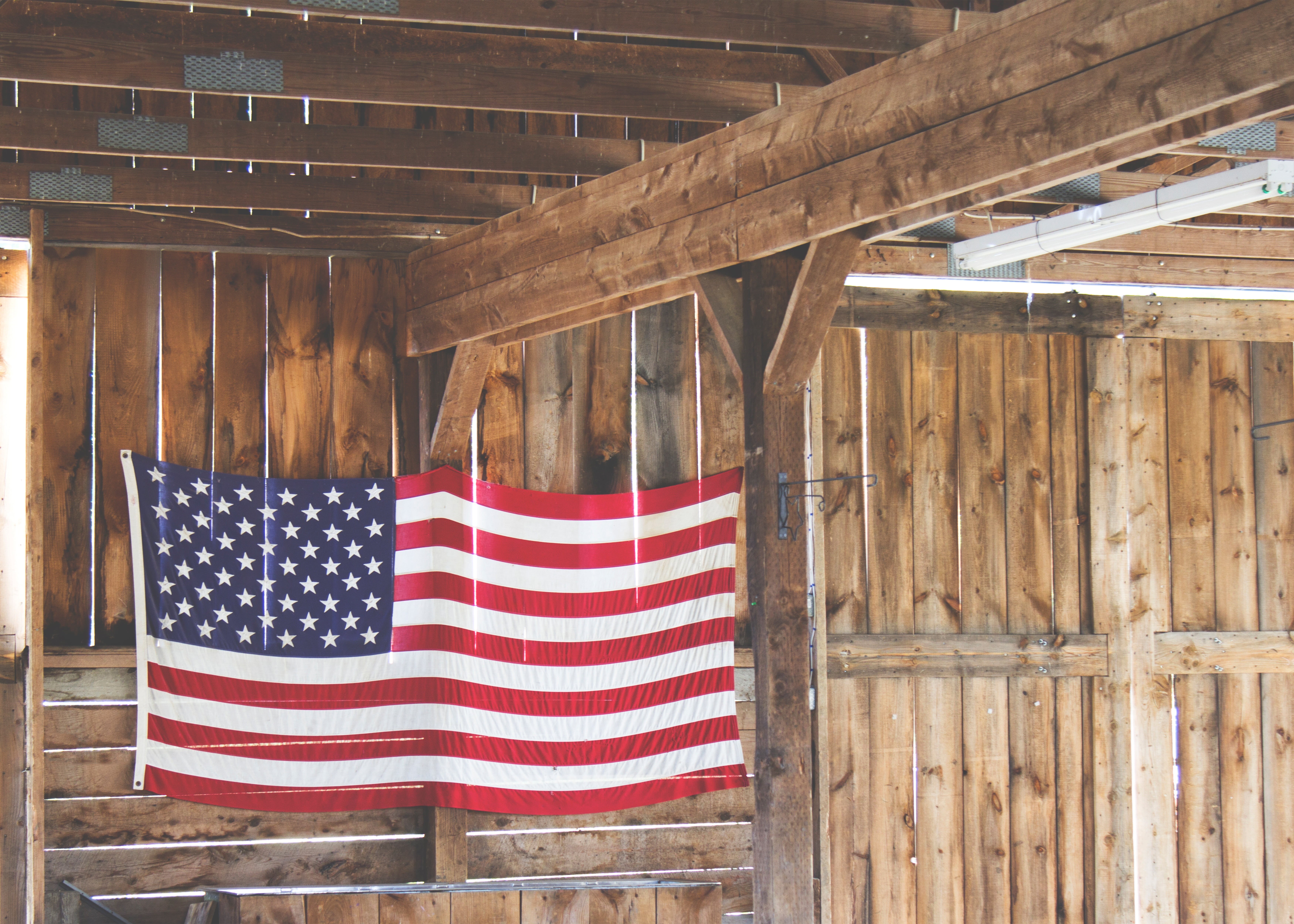 stars and stripes, architecture, day, american Flag, pattern, wood, patriotism, barn, built structure, hanging, flag, plank, log cabin, low angle view, HD Wallpaper