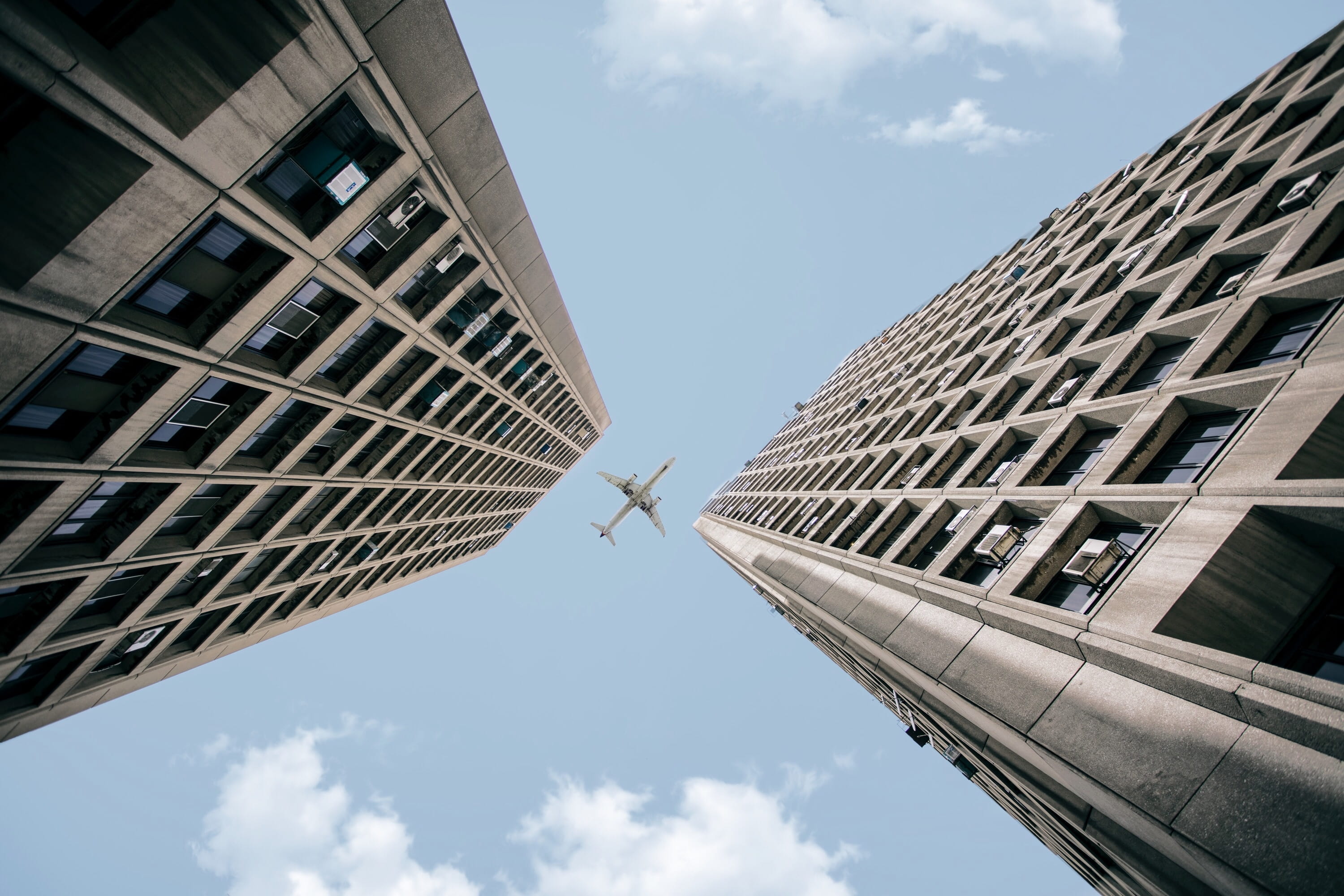 cloud, low Angle View, blue sky, angle, airplane, glass - Material, finance, day, outdoors, skyscraper, sky, reflection, architecture, building, business, HD Wallpaper