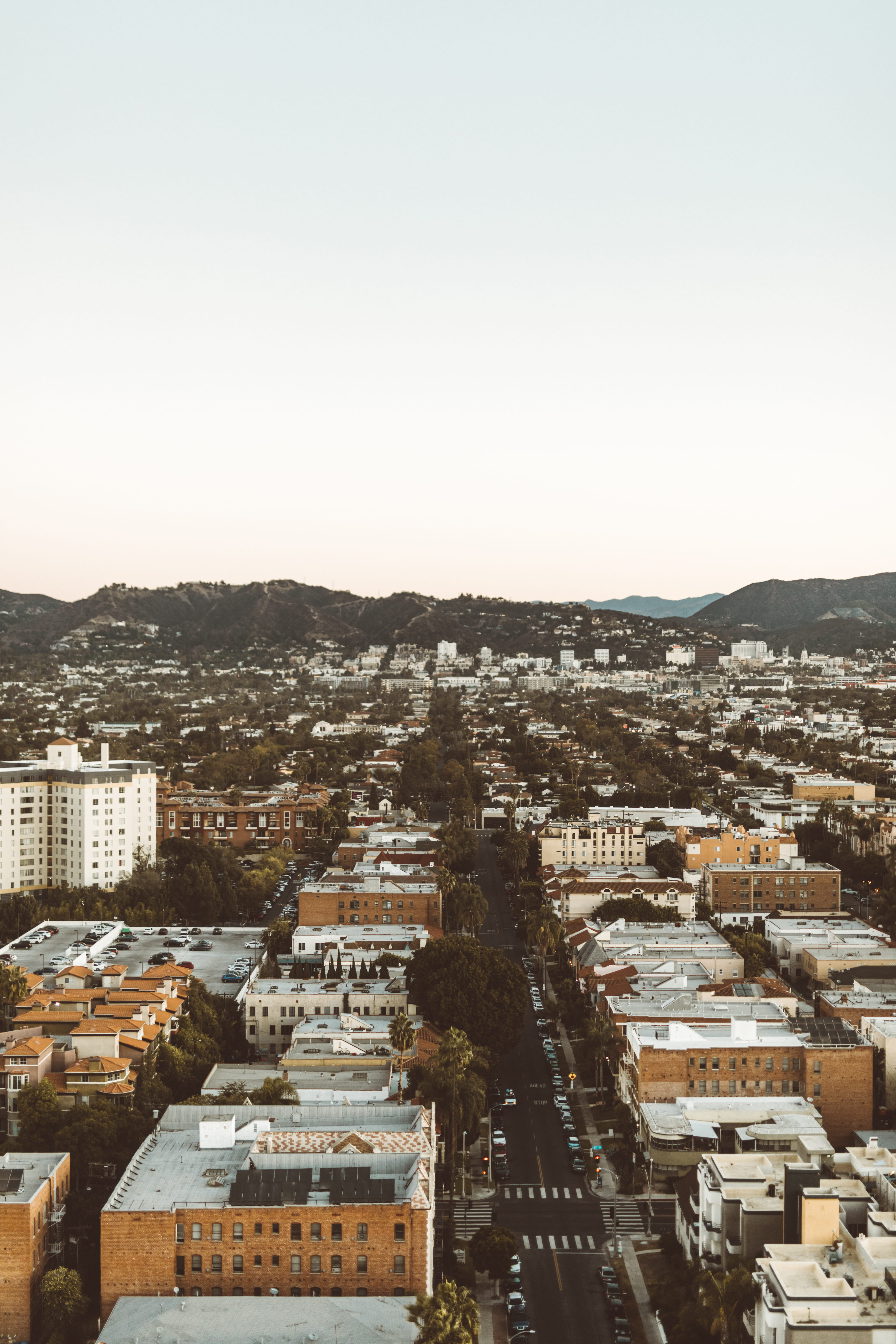 buildings, 5K, la, city life, copy space, mountain, clear sky, weho, high angle view, townscape, sky, urban, drone view, road, outdoors, crowd, modern design, Phone HD Wallpaper