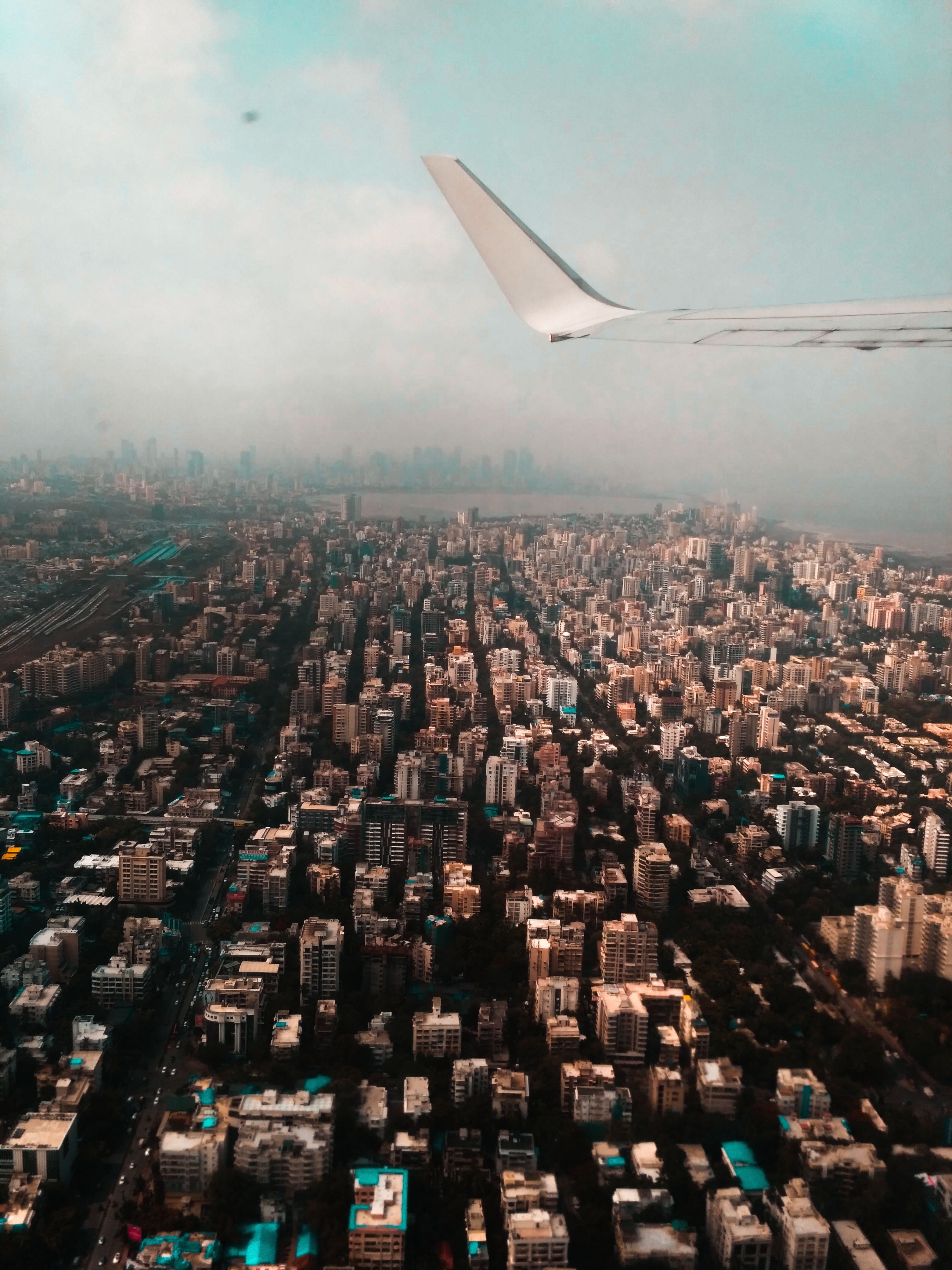 built structure, skyscraper, outdoors, clouds, cityscape, transportation system, buildings, nature, city, roads, aircraft wing, travel destinations, office building exterior, Phone HD Wallpaper