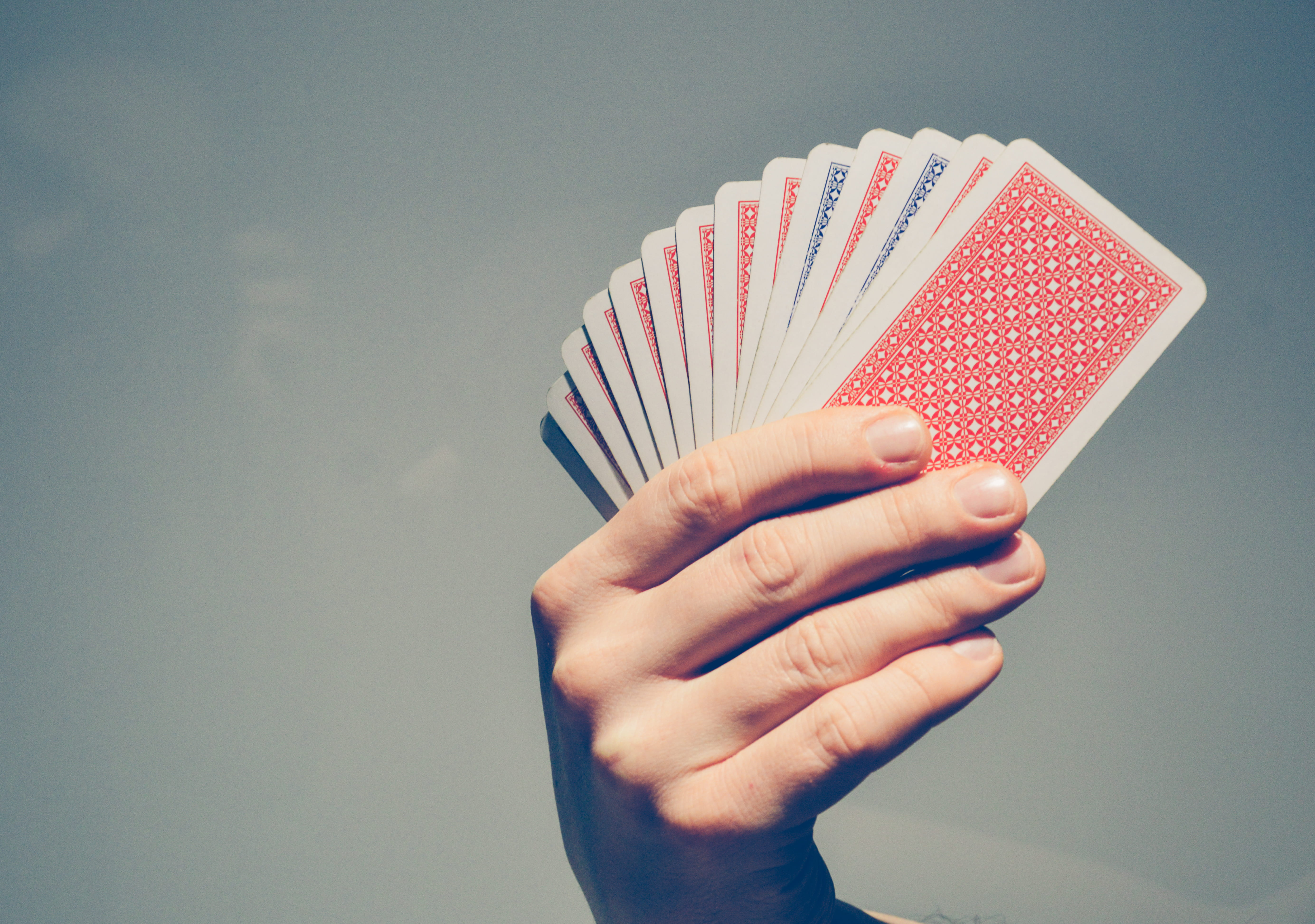 leisure games, gambling, human body part, leisure activity, luck, human hand, red, arts culture and entertainment, gray, studio shot, 5K, close-up, holding, HD Wallpaper