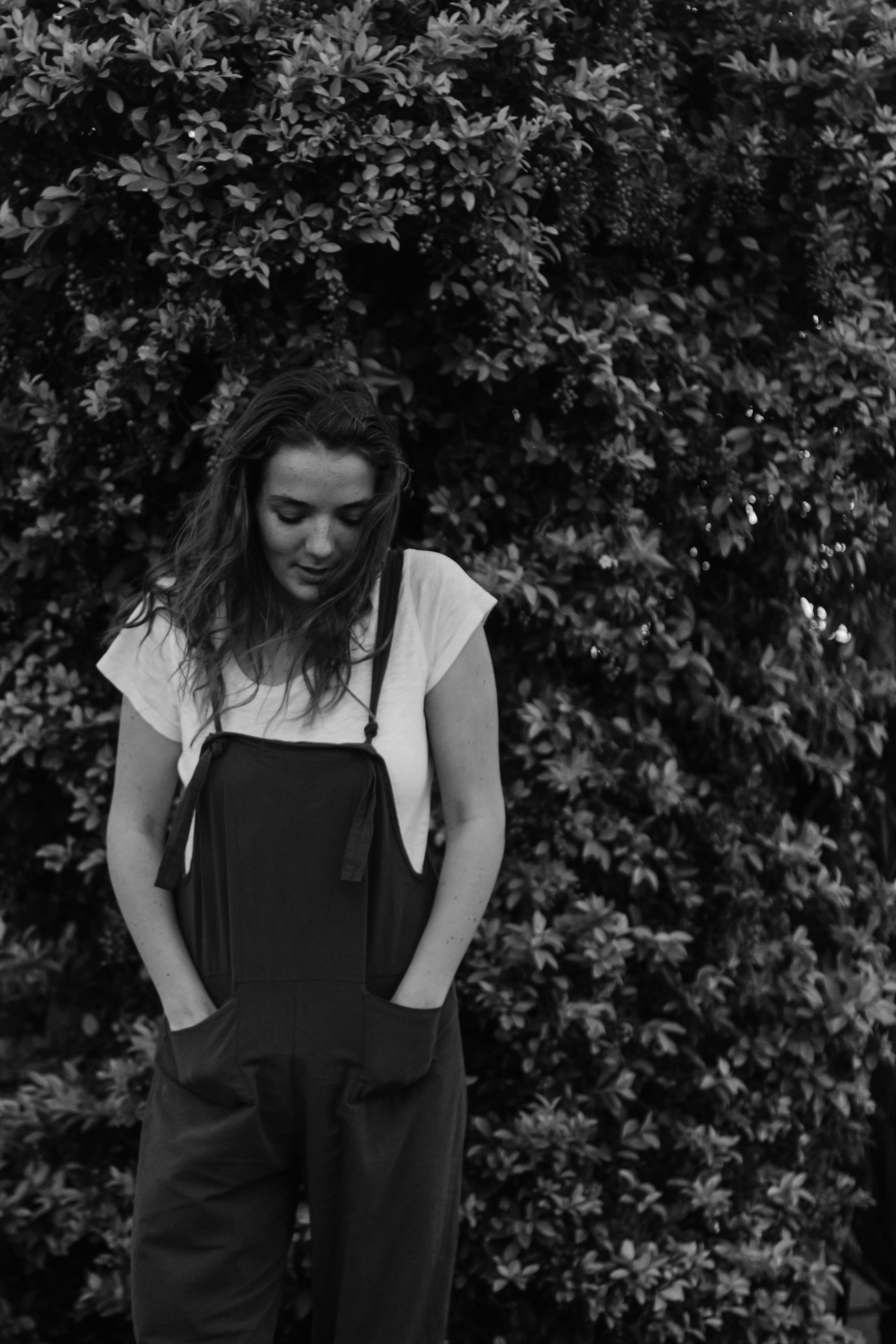undershirt, girl, female, clothing, portrait, casual clothing, hairstyle, photography, tree, contemplation, outdoors, young adult, young women, plant, front, Phone HD Wallpaper