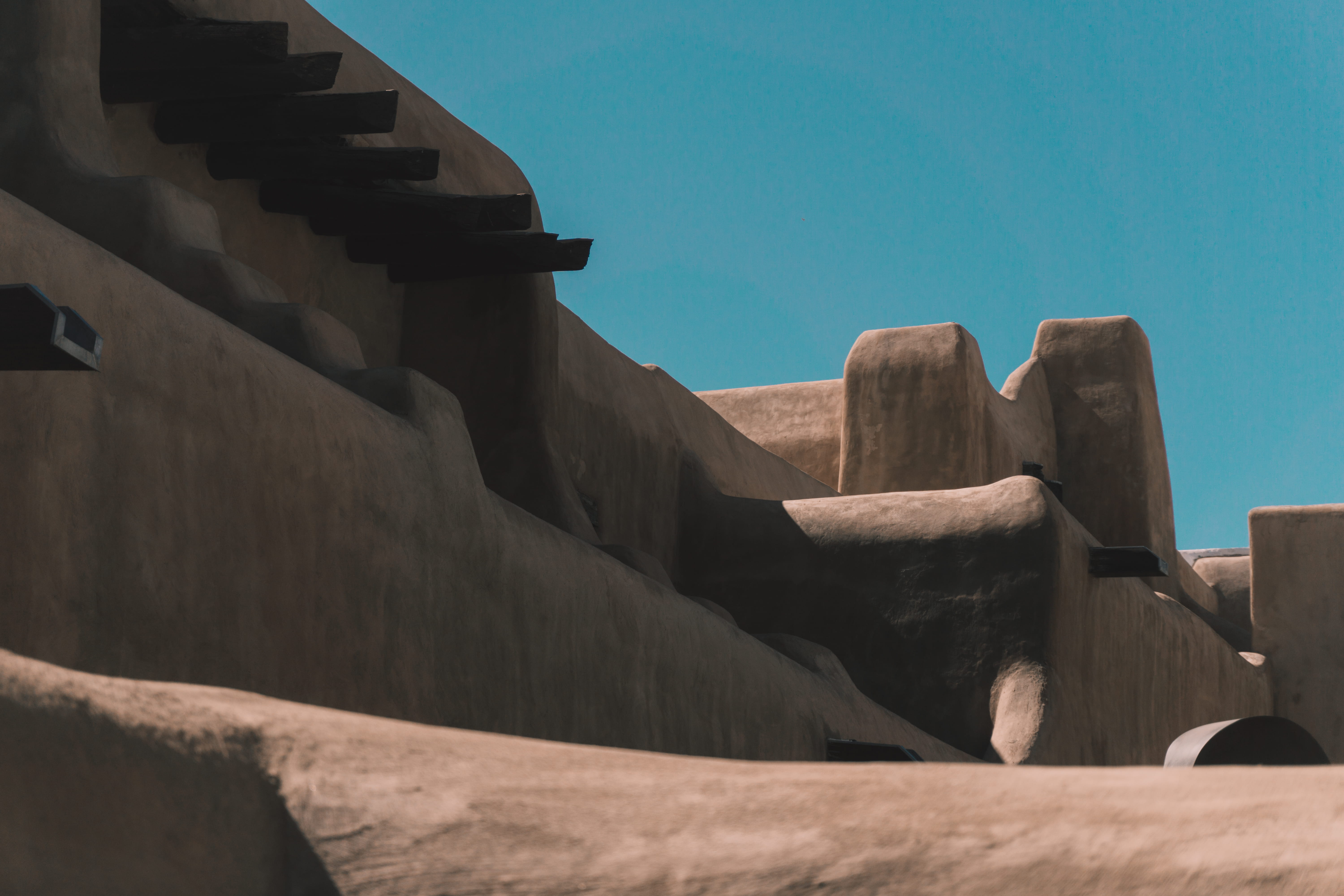 sunlight, santa fe, outdoors, ancient civilization, low angle view, solid, harsh light, clear sky, adobe, united states, dawn, blue, vibrant, built structure, HD Wallpaper
