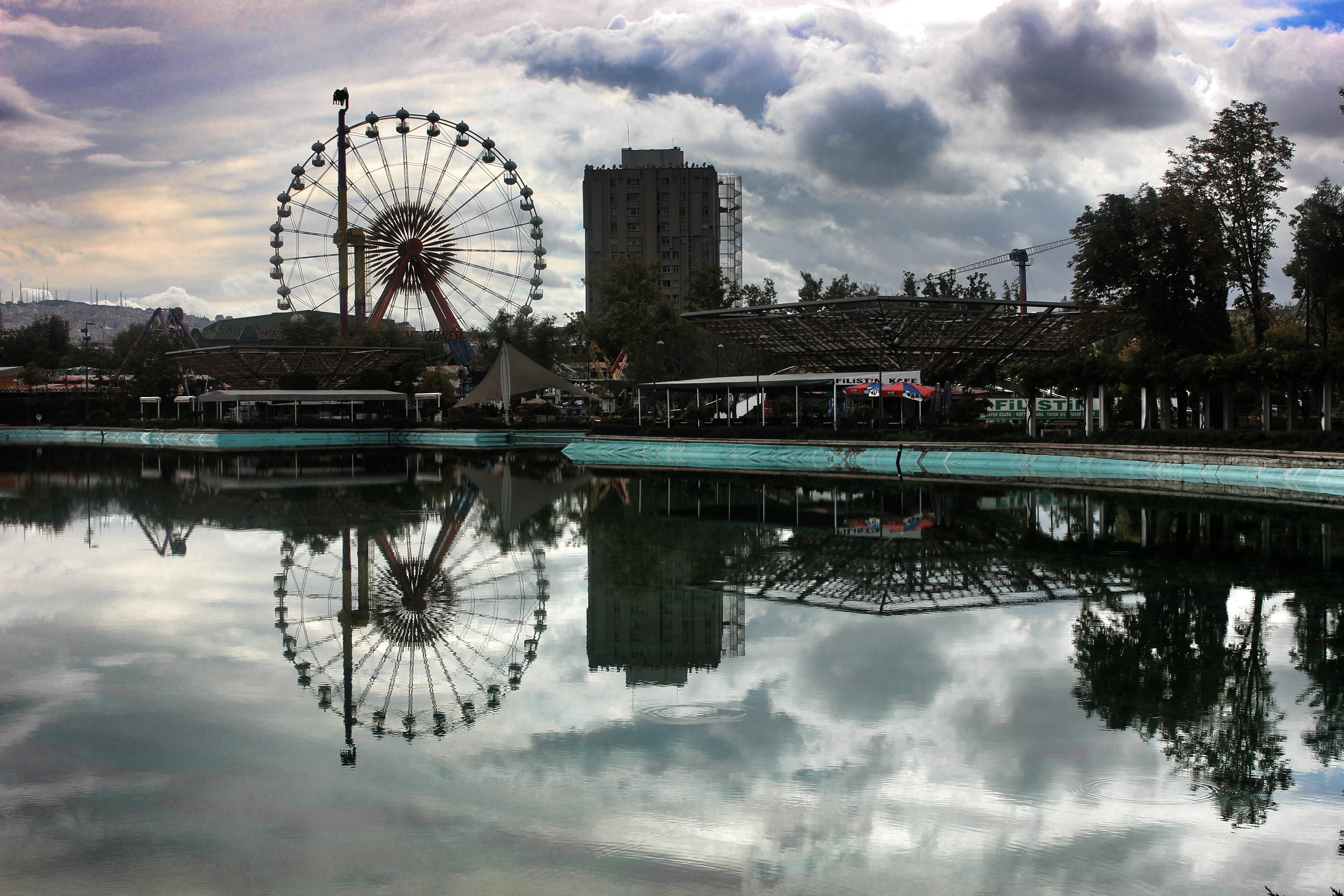 cloud - sky, no people, travel destinations, building exterior, reflection, landscape, day, 5K, built structure, sky, amusement park ride, pool, ferris wheel, HD Wallpaper