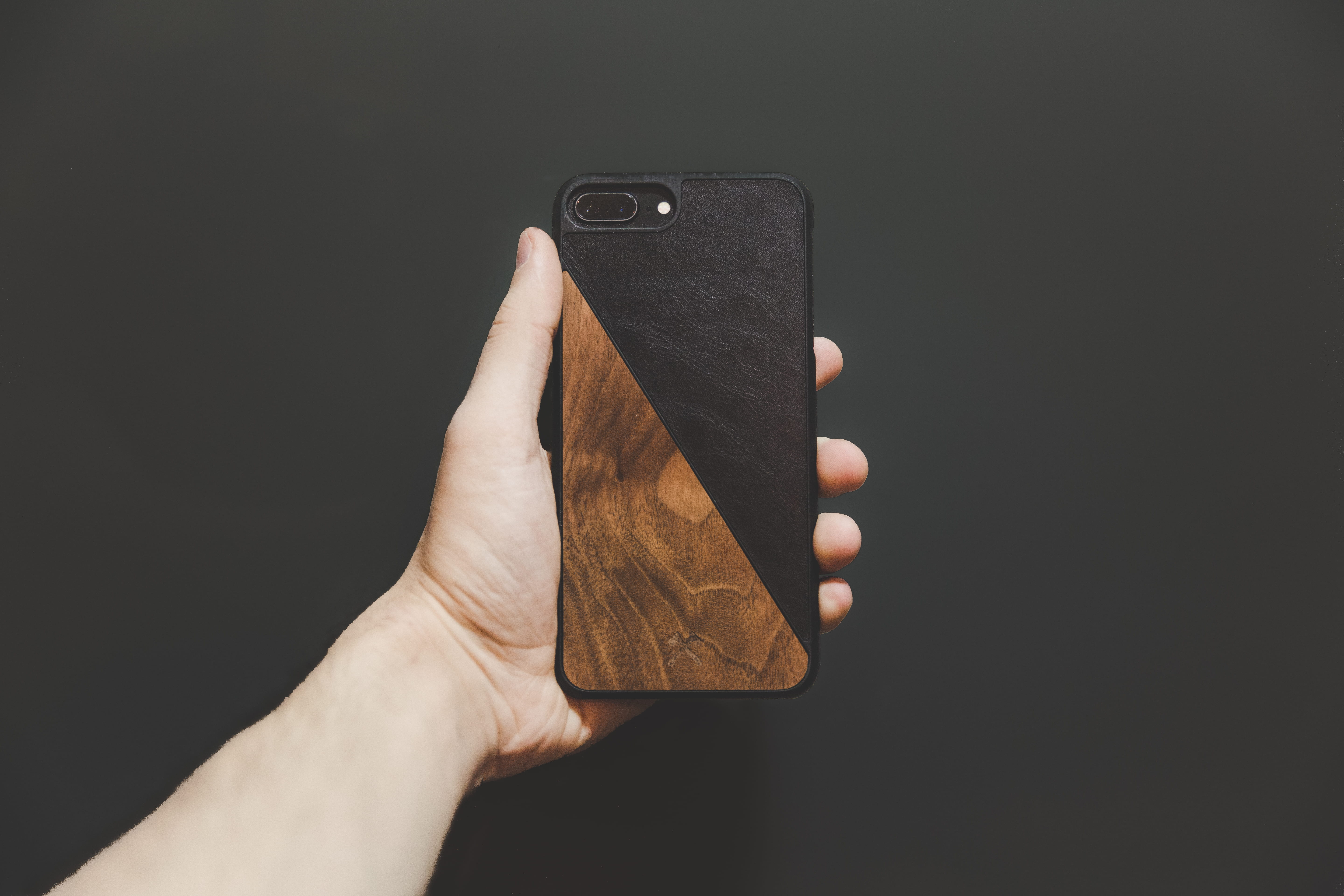 case, indoors, 5K, phone, holding, hand, connection, black, brown, person, body part, iphone, personal perspective, smart phone, communication, wooden, HD Wallpaper