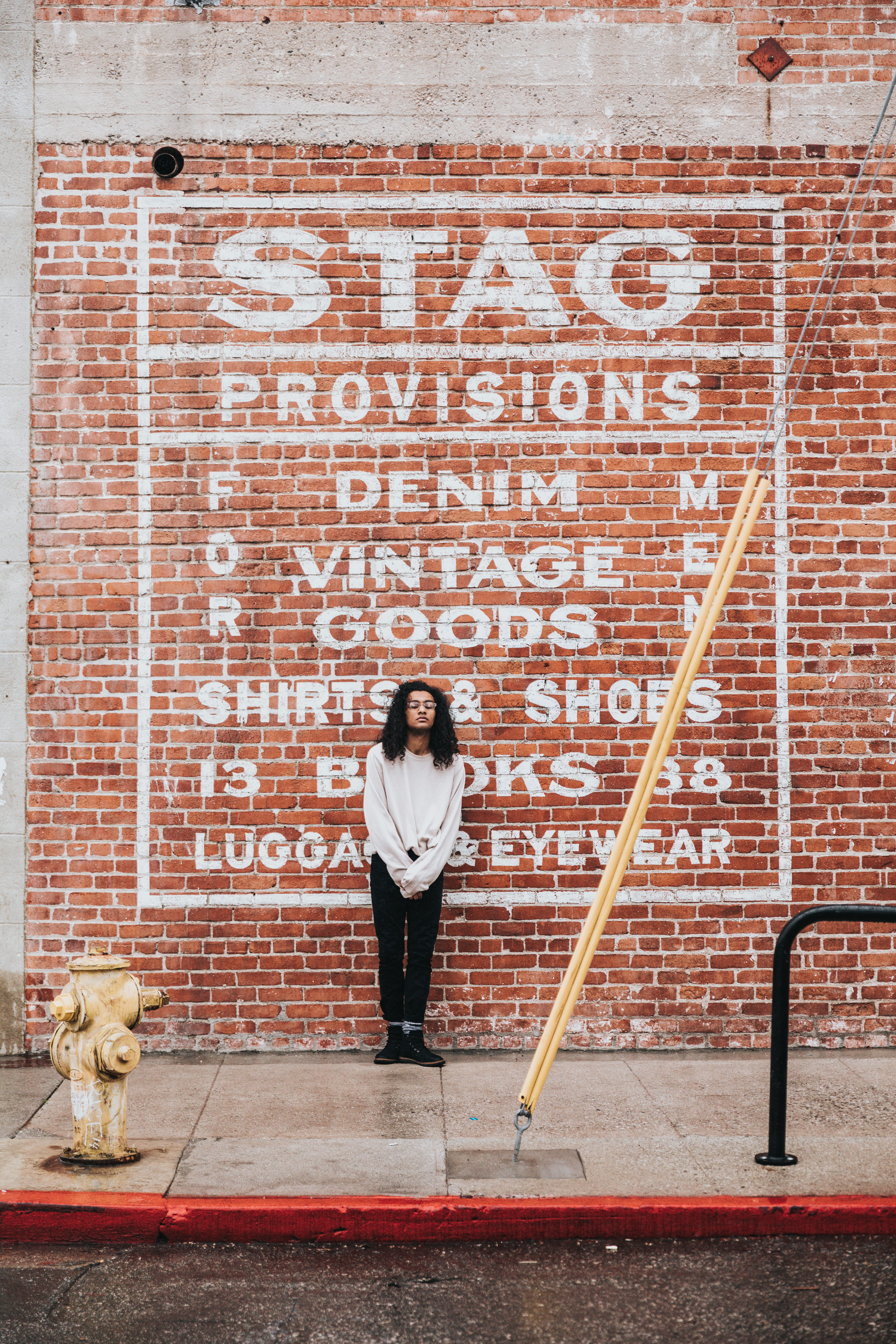 near, real people, brick, vintage, person, lady, one person, day, boot, bricks, sweater, white, communication, street, sign, girl, brick wall, man, front view, Phone HD Wallpaper