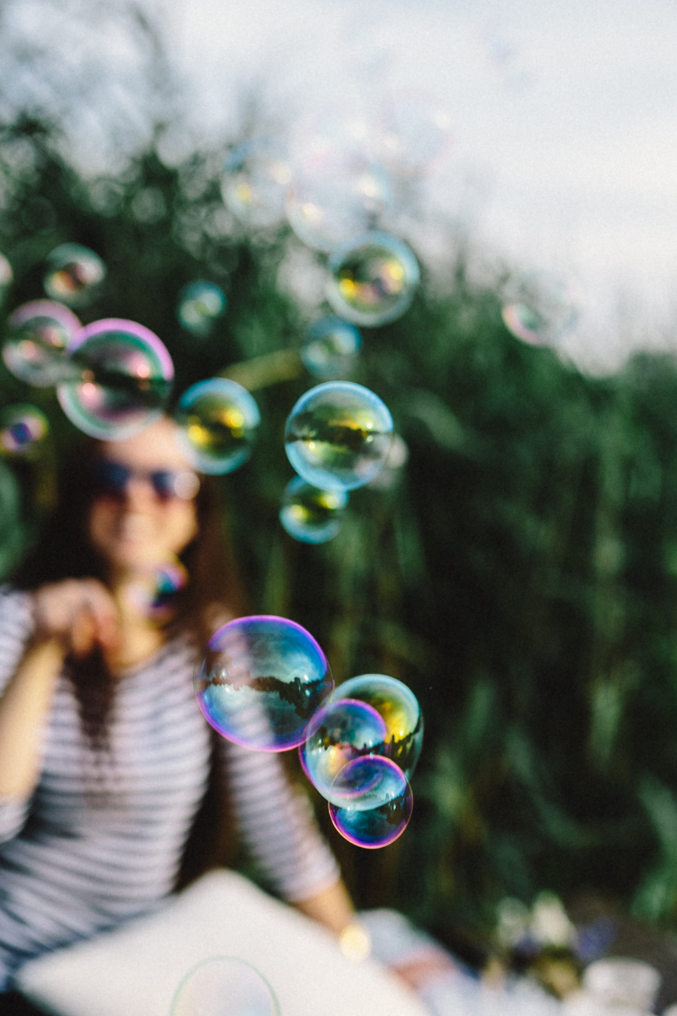 playing, bubbles, girl, bubble, holidays, 2K, lifestyles, woman, blowing, outdoors, soap, fun, playful, one person, mid-air, selective focus, focus on foreground, Phone HD Wallpaper