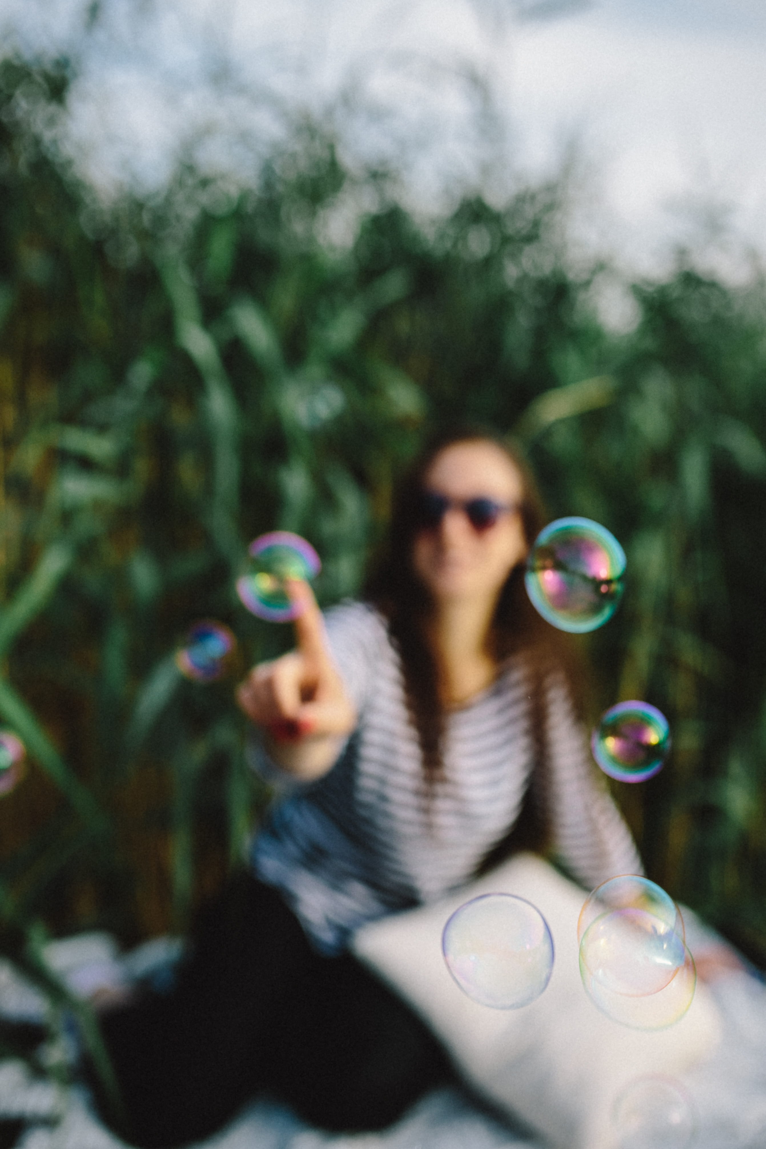 fun, bubble Wand, happiness, cheerful, childhood, selective focus, carefree, day, leisure activity, soap bubbles, vulnerability, mid-air, smiling, 4K, Phone HD Wallpaper