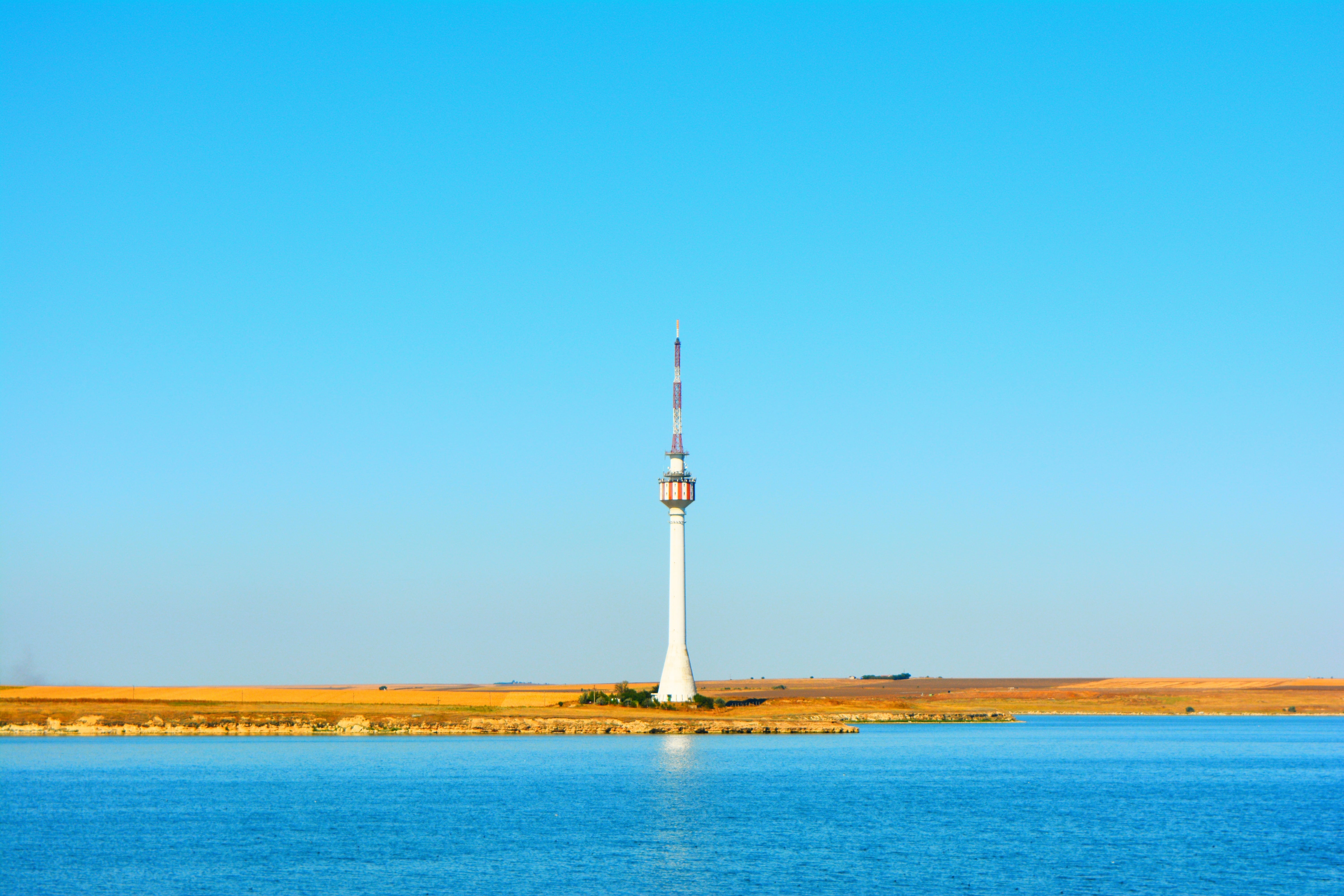 great, spire, seaside, sky, lighthouse, building, no people, guidance, 5K, constant, building exterior, far, travel destinations, clear sky, lake, travel, HD Wallpaper