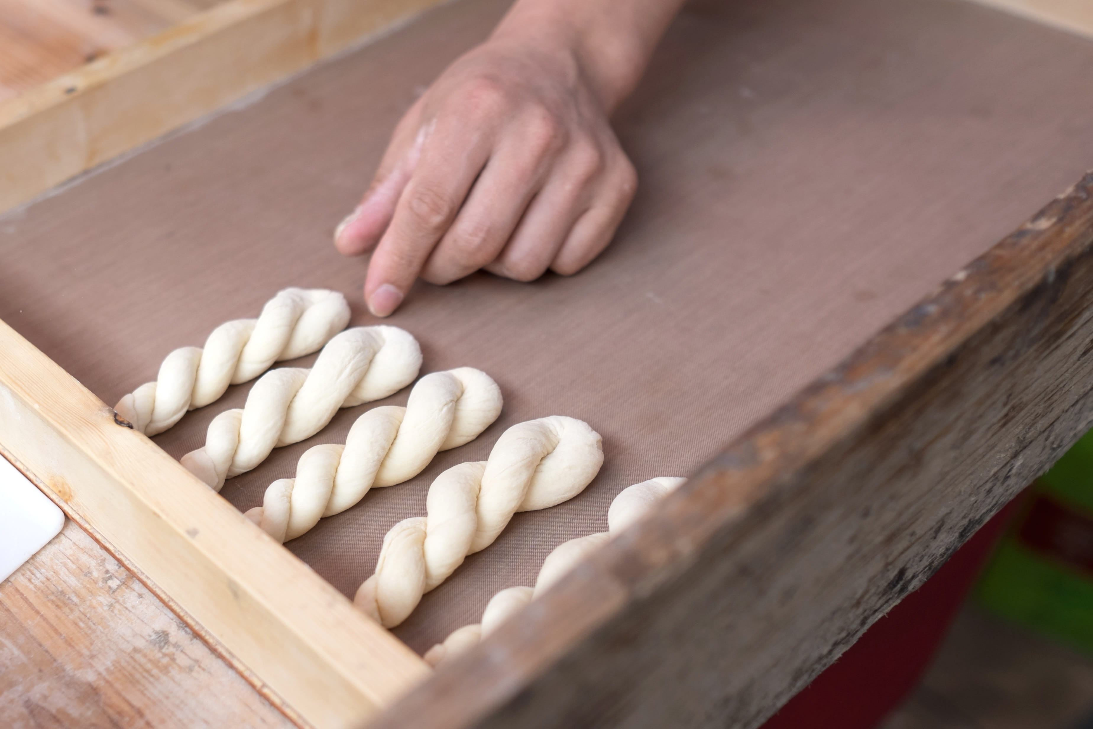 dessert, bread, freshness, real people, high angle view, preparation, republic of korea, pretzel, finger, one person, wood - material, sweet, fry, human hand, HD Wallpaper