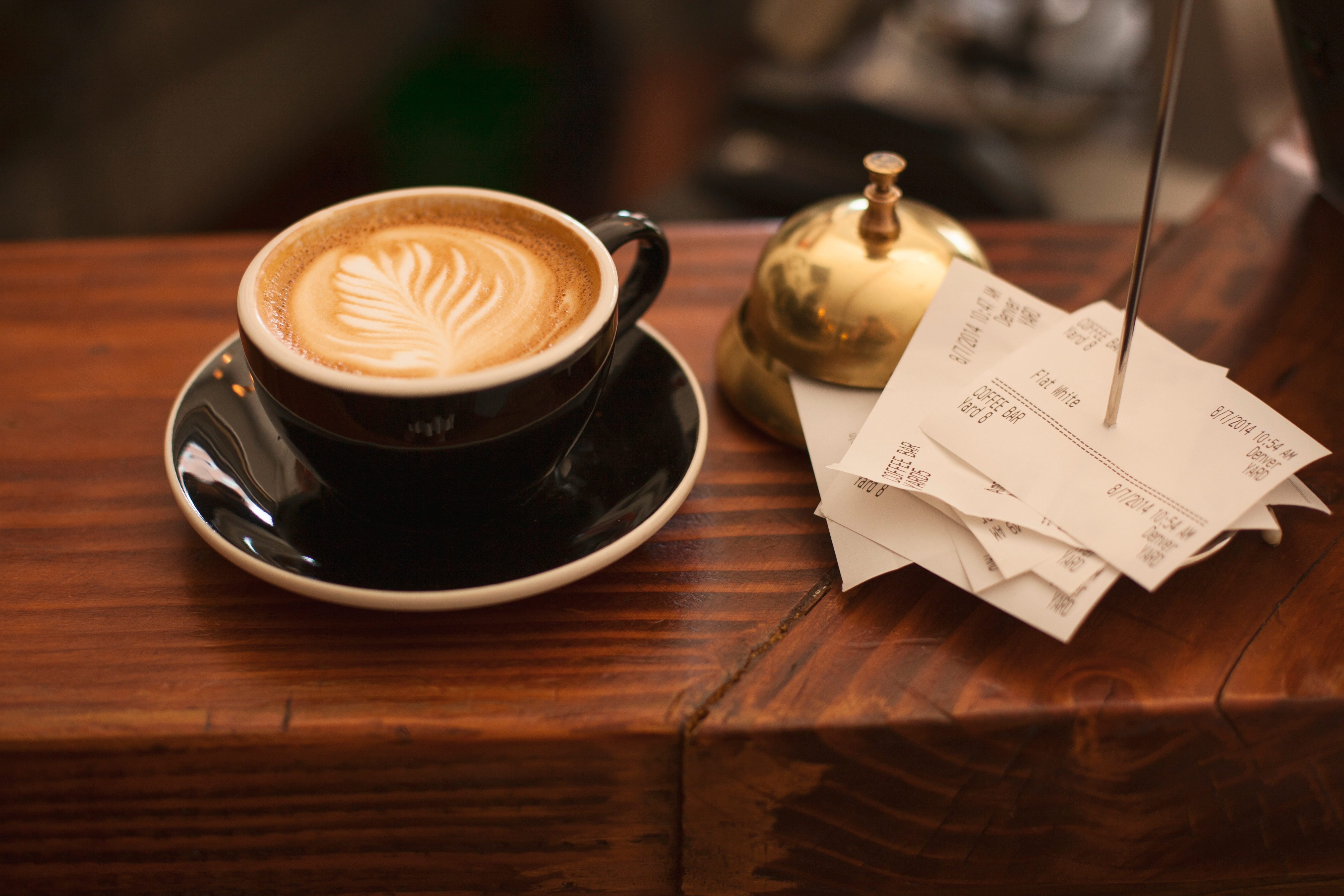 cup, drink, refreshment, black, table, 5K, wood grain, no people, latte, bell, mug, food and drink, wood - material, coffee, brown, cafe, crockery, hot drink, HD Wallpaper