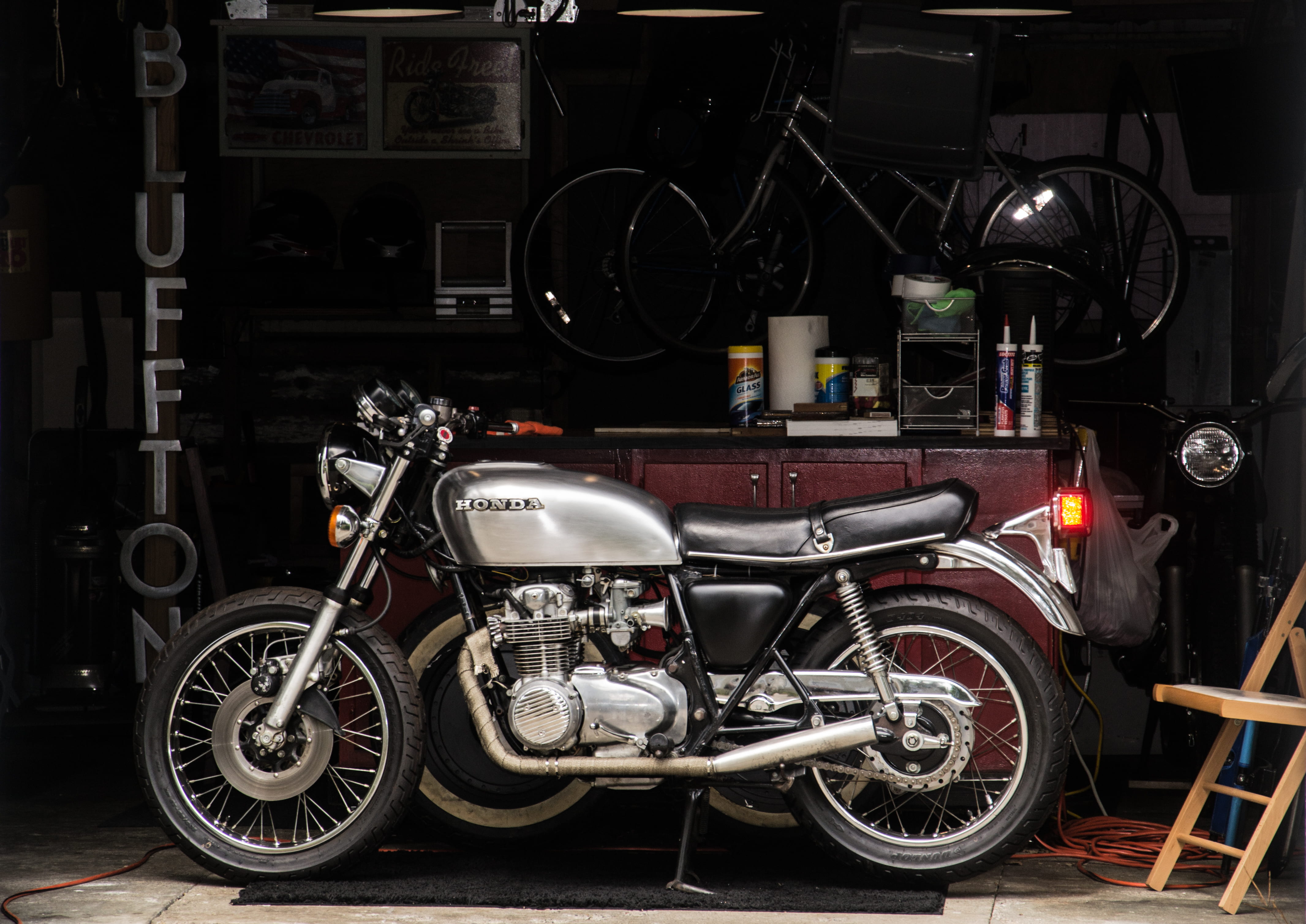 no people, baby, larry, indoors, garage, cafe racer, store, mode of transportation, retro styled, large group of objects, dark, shelf, 4K, motor vehicle, HD Wallpaper