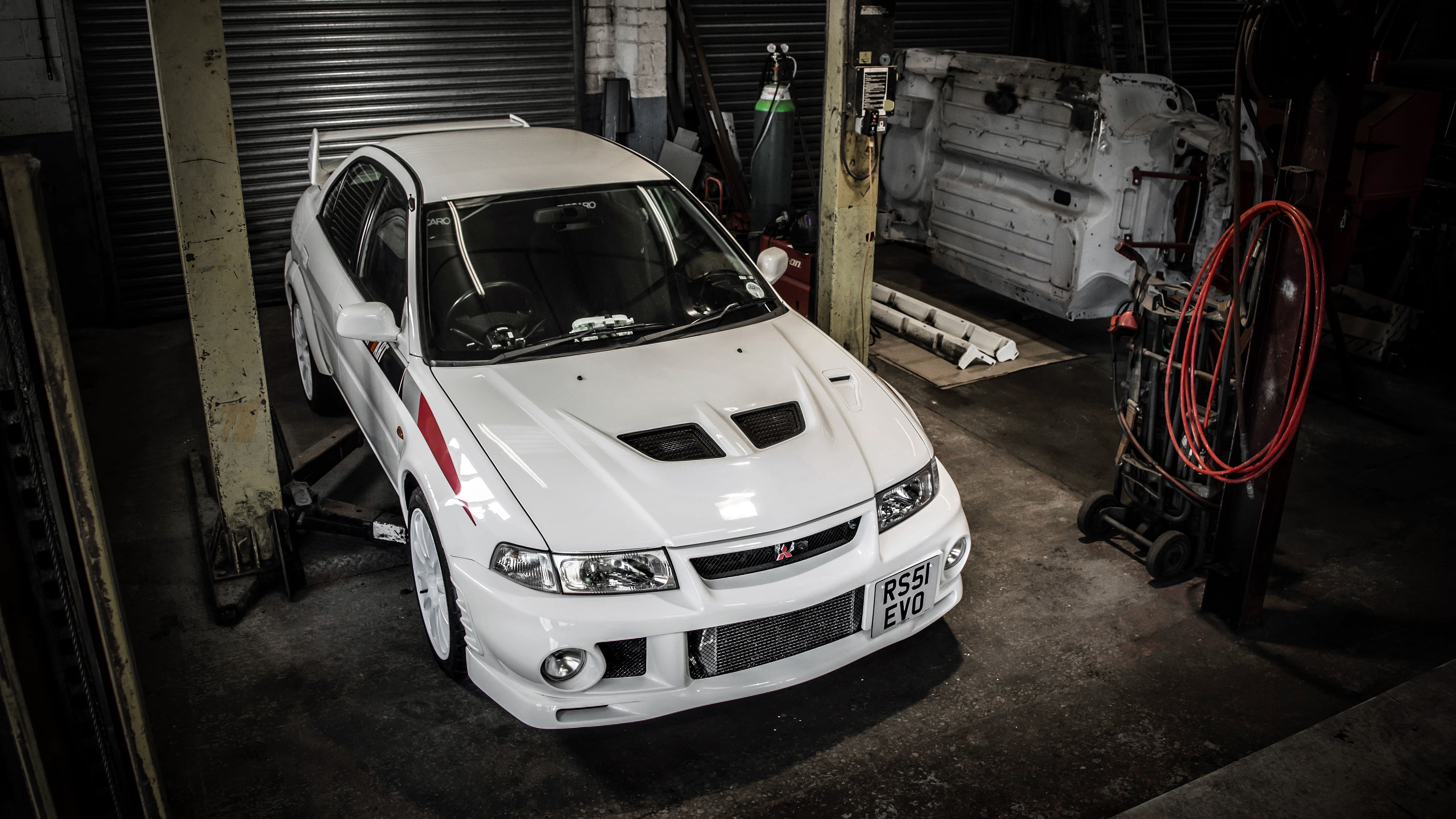 mitsubishi lancer, indoors, mitsubishi lancer evolution, automobile industry, mechanic, transportation, parking, car, sedan, land vehicle, truck, no people, HD Wallpaper