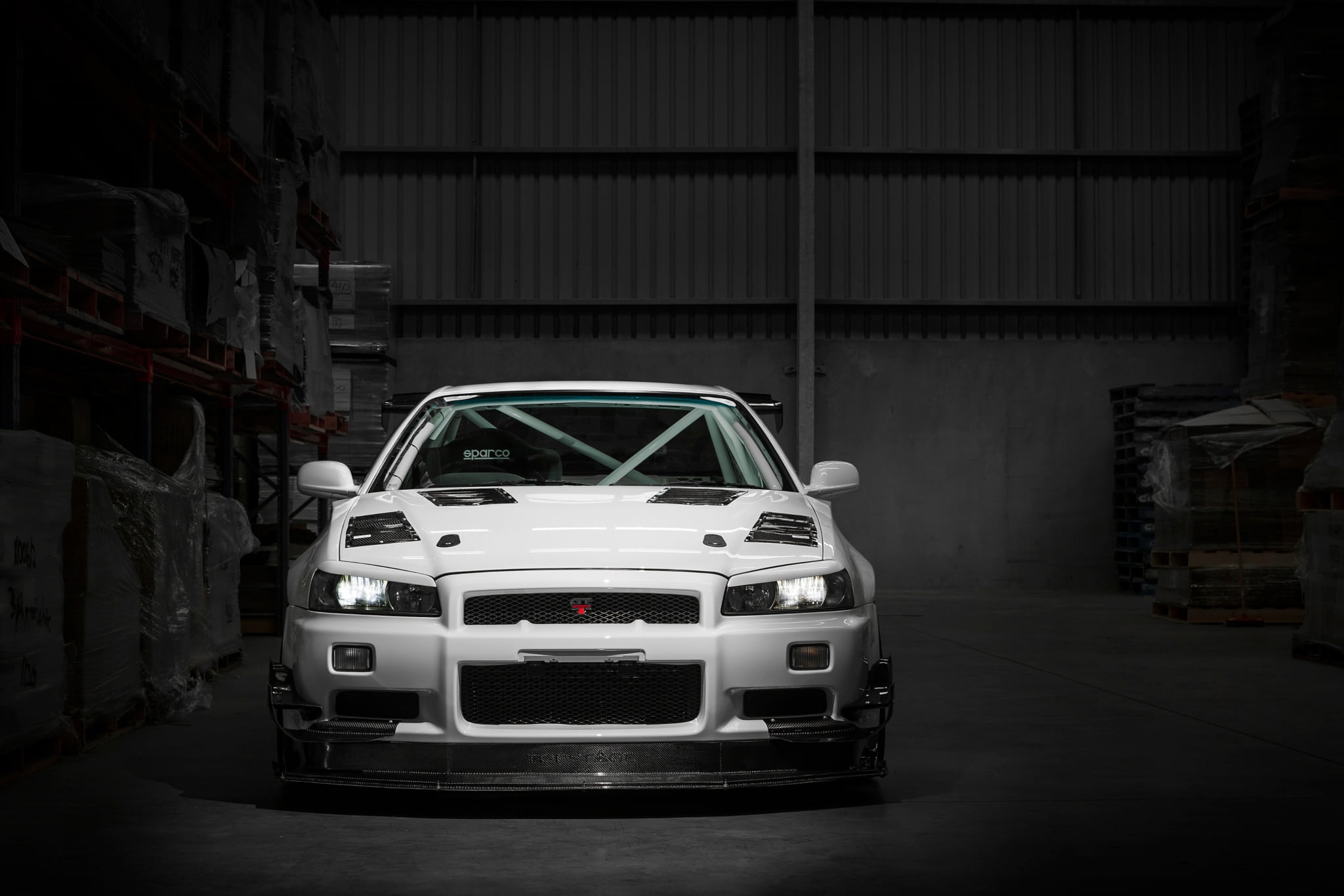no people, built structure, mode of transportation, auto repair shop, Nissan, stationary, architecture, Skyline, automobile industry, R34, dark warehouse, HD Wallpaper