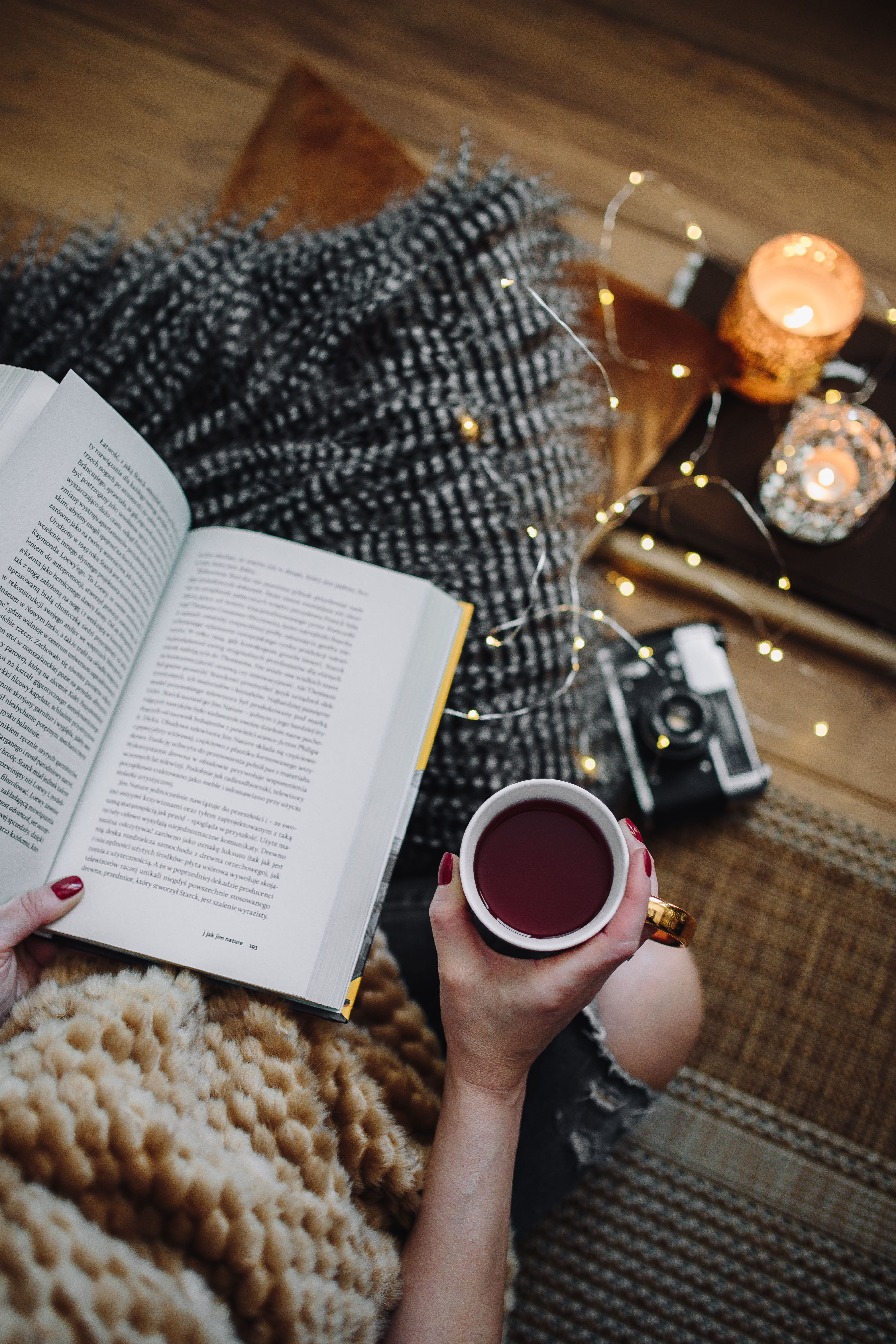 hygge, women, high angle view, book, female, coffee - Drink, fairy lights, refreshment, fruit tea, coffee cup, indoors, food, table, home, unrecognizable person, Phone HD Wallpaper