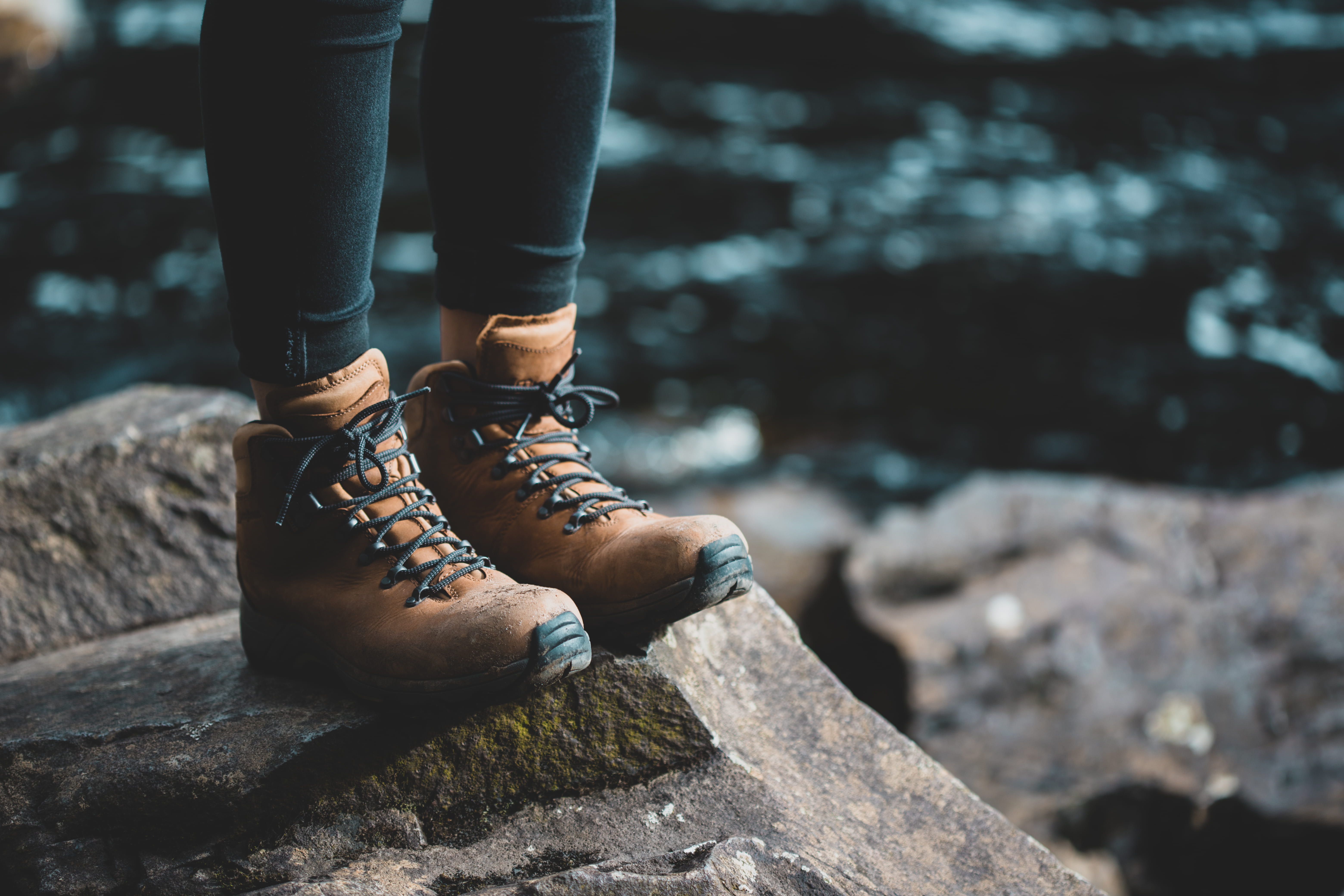 real people, low section, outdoors, boots, standing, day, wearing, nature, water, rock, one person, leisure activity, human leg, person, solid, hike, focus on foreground, HD Wallpaper
