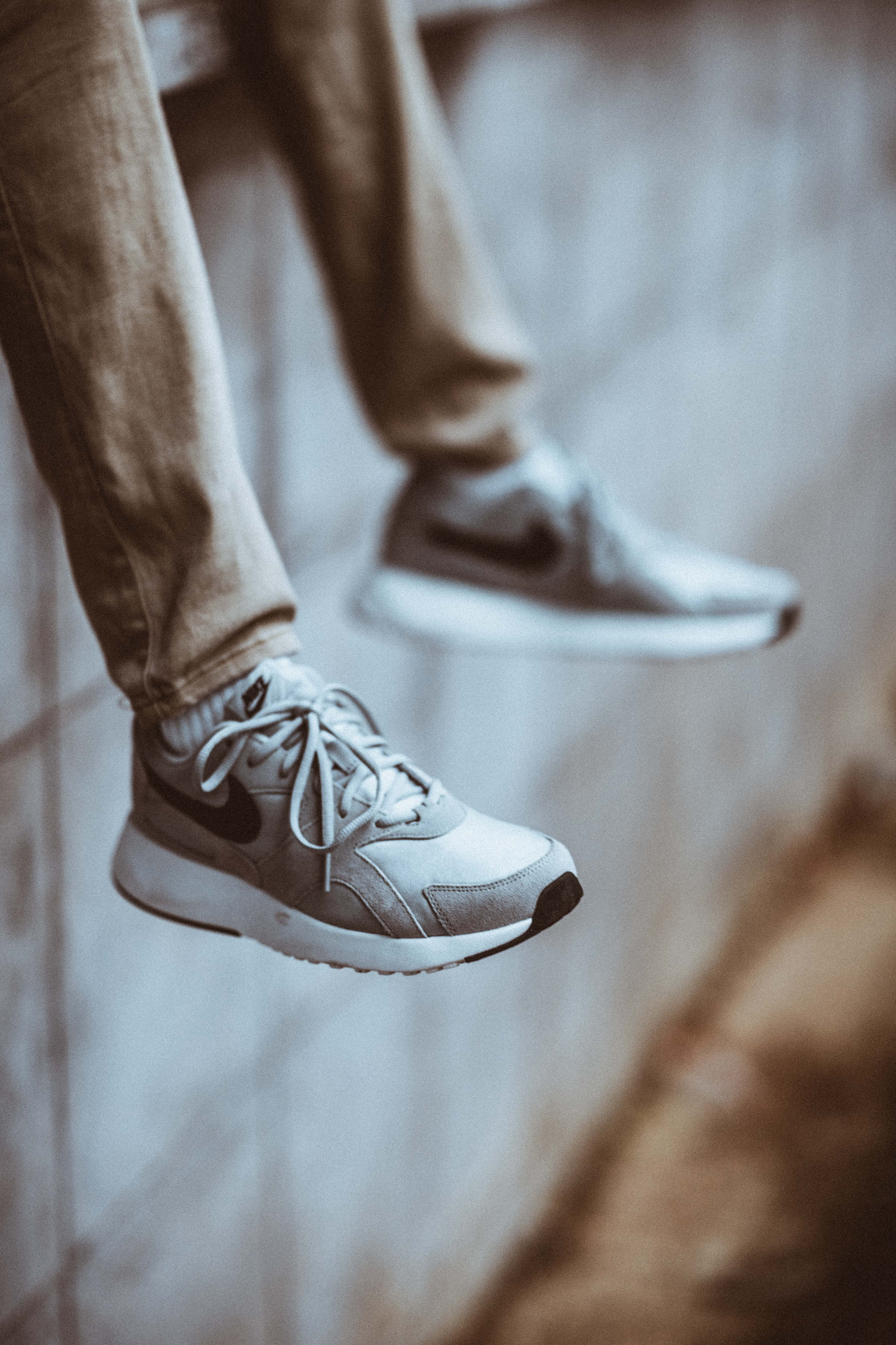 photo, nike, human limb, person, wearing, dangling feet, limb, human leg, footwear, real people, sneakers, jeans, low section, human foot, focus on foreground, Phone HD Wallpaper