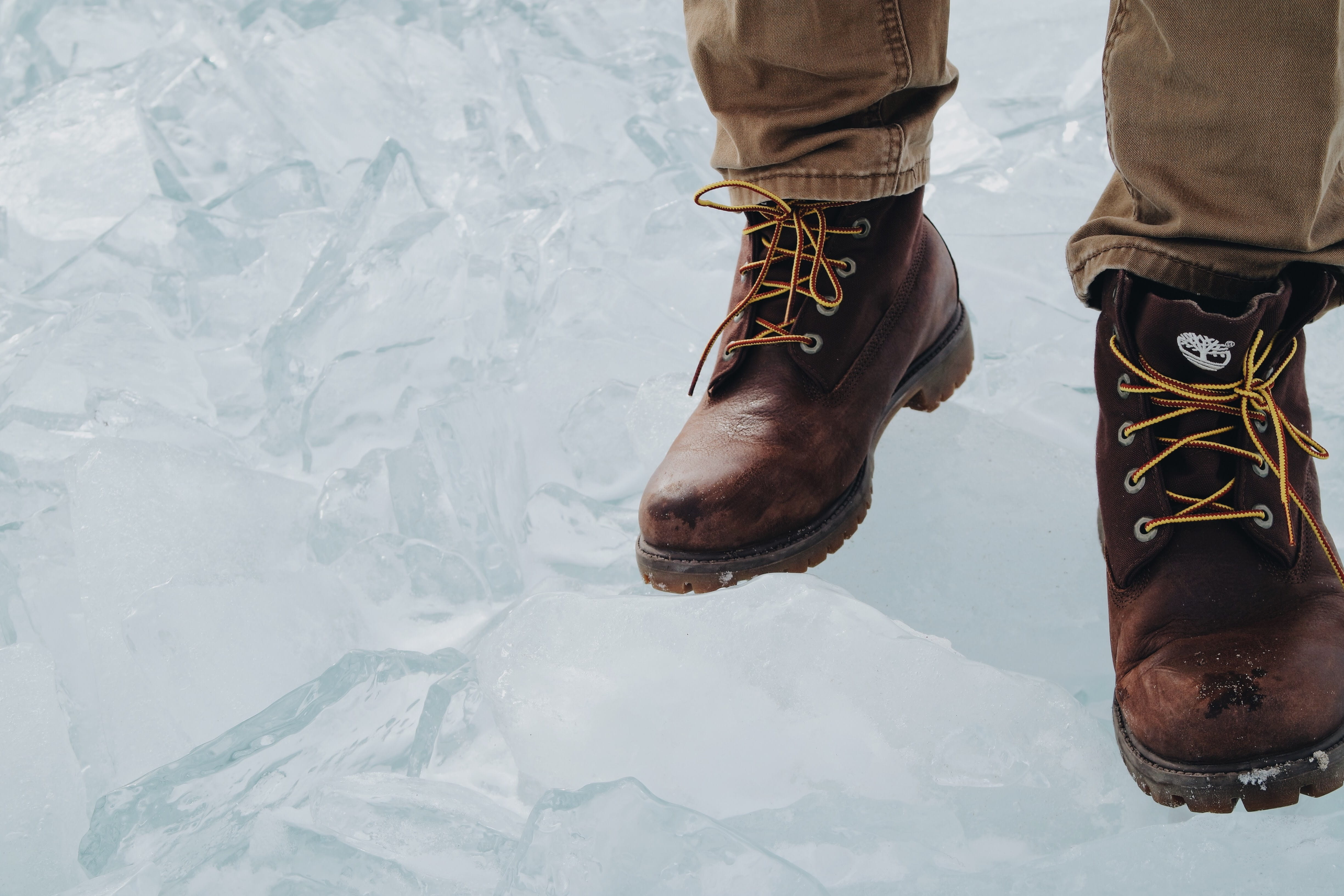 leisure activity, winter, warm clothing, ground, unrecognizable person, clothing, 4K, apparel, human, timberland, lifestyles, brown, low section, wearing, HD Wallpaper