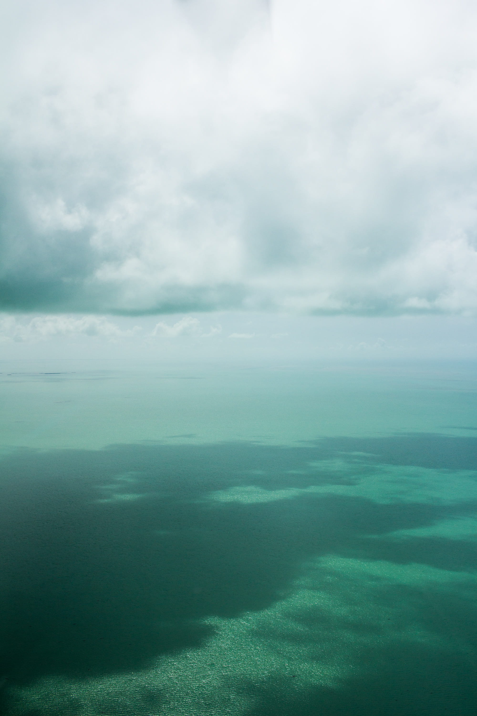 cloudscape, tranquility, no people, sky, landscape, beauty in nature, water, outdoors, environment, tranquil scene, green color, idyllic, turks and caicos islands, Phone HD Wallpaper
