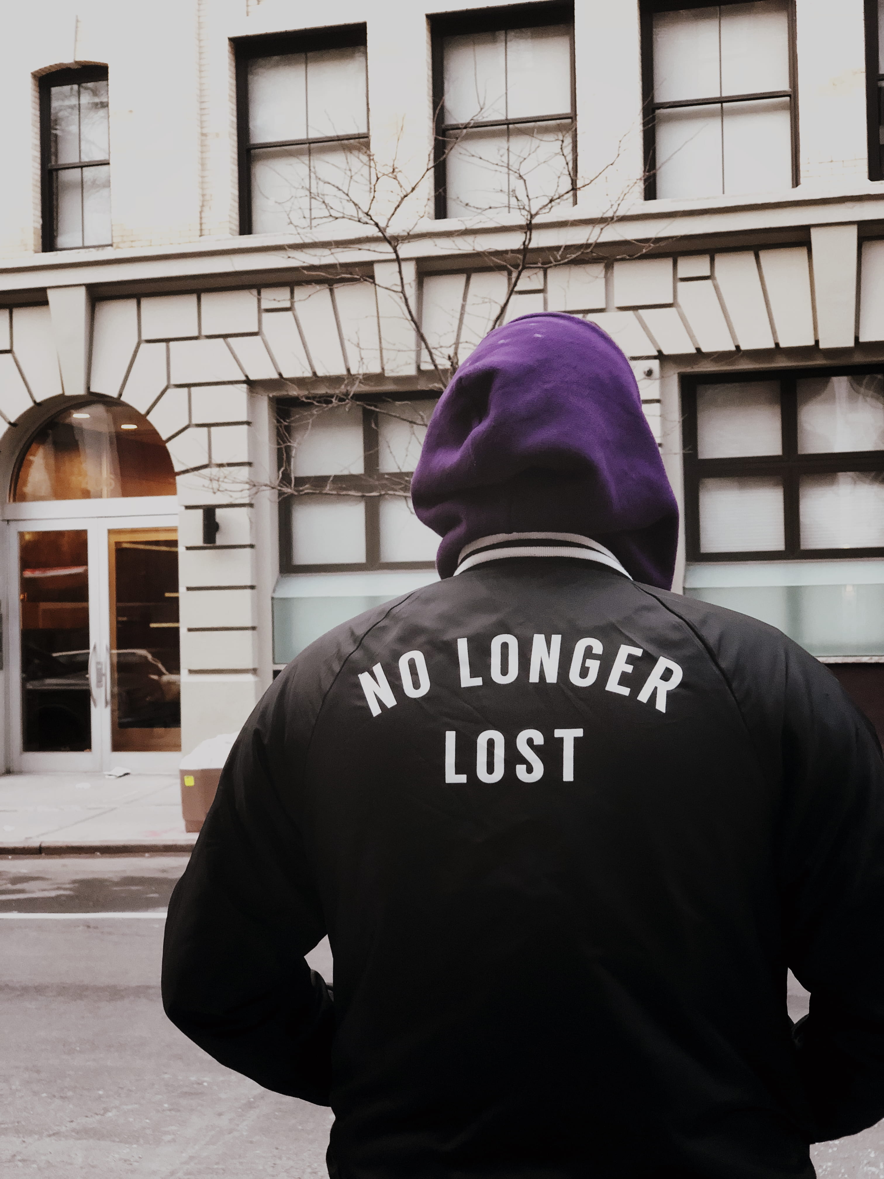 street, warm clothing, phrase, slogan, easter, built structure, hat, saying, uniform, rear view, jacket, concrete, hoodie, man, western script, text, real people, Phone HD Wallpaper