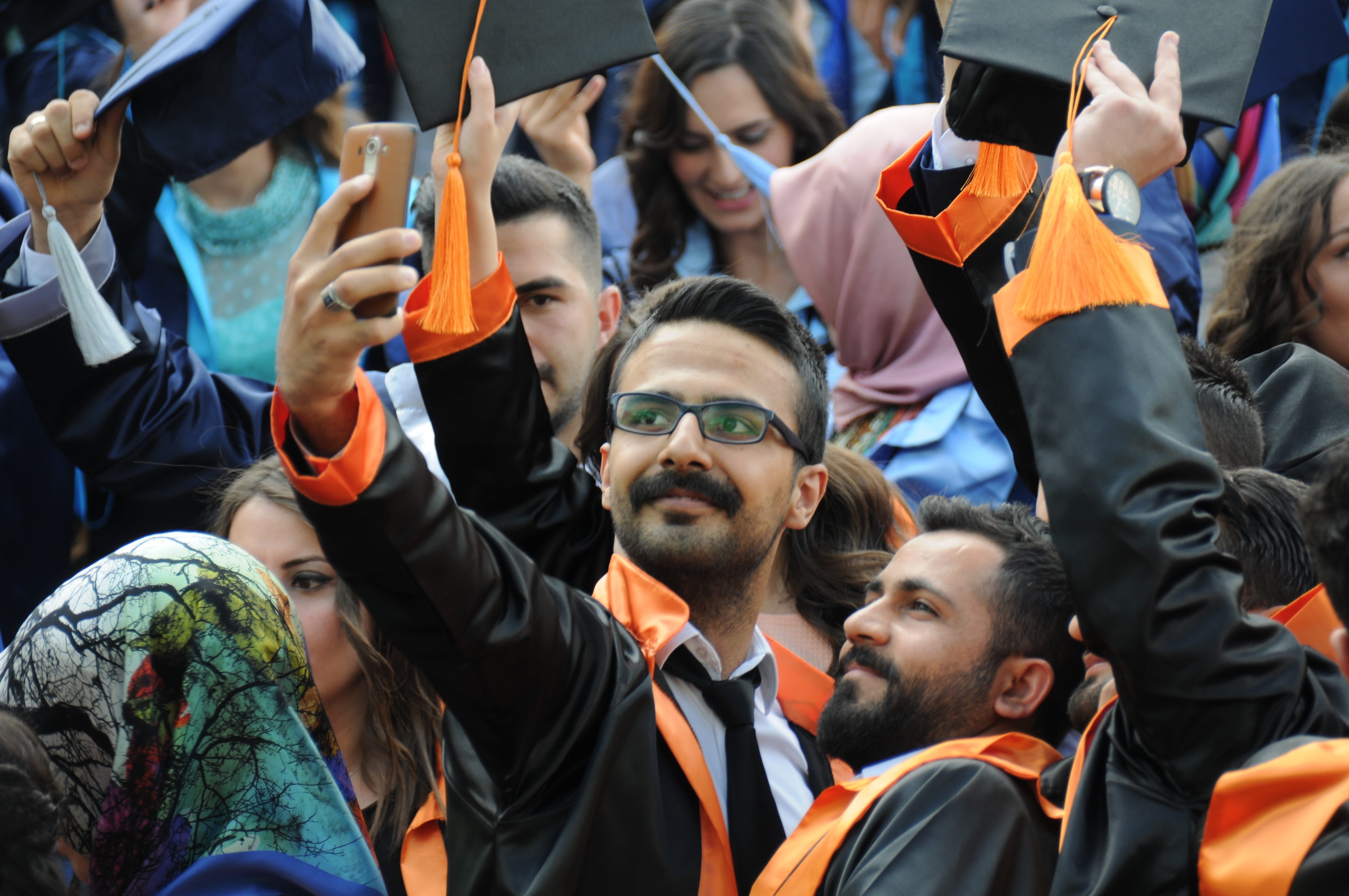 education, person, Graduation, selfie, unity, stadium, arms raised, University, women, group of people, outdoors, day, team sport, crowd, looking away, HD Wallpaper
