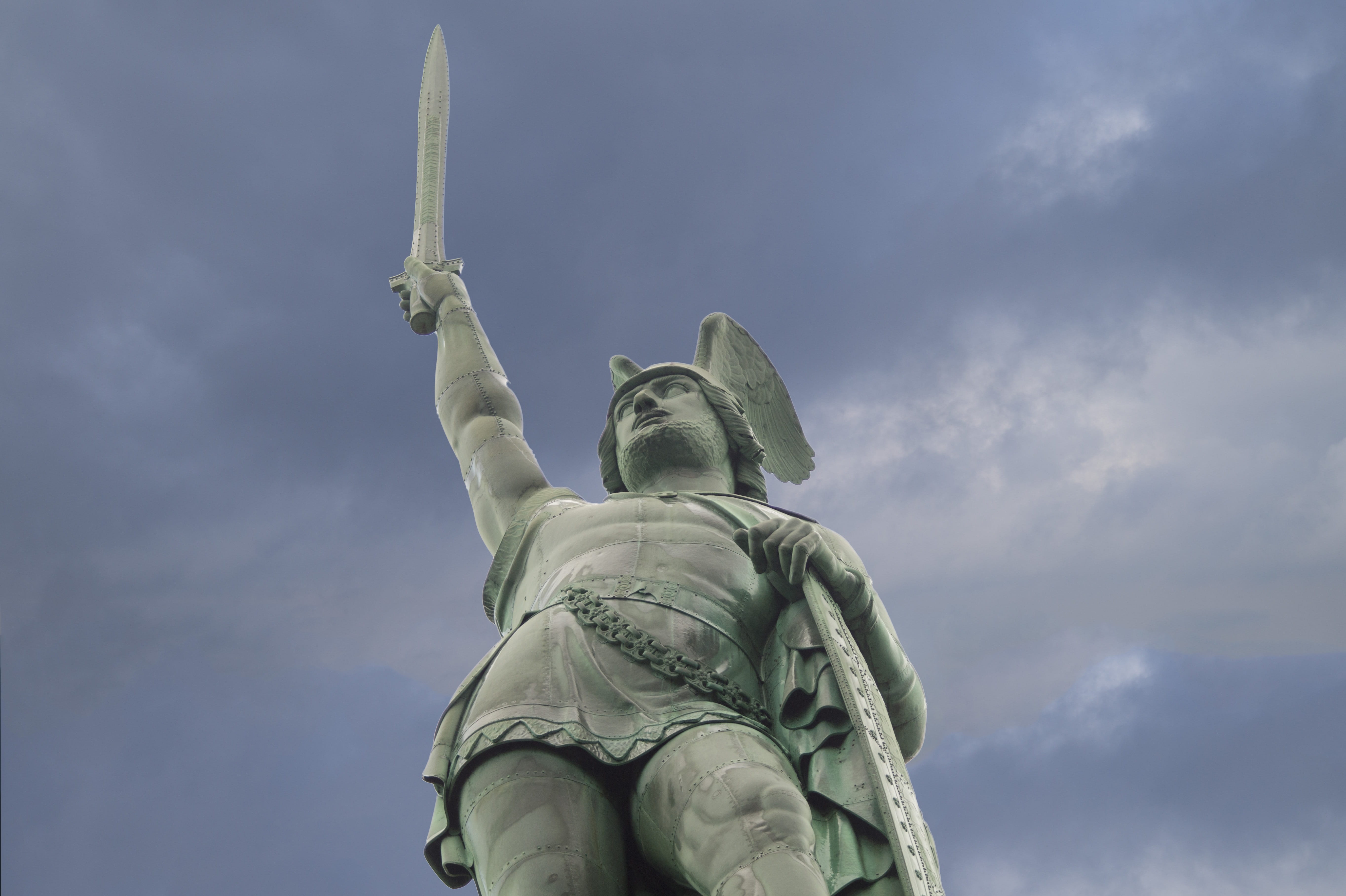 shield, low angle view, human representation, no people, sky, raising, travel destinations, sculpture, new York City, teuteburg, rome, daytime, female likeness, HD Wallpaper