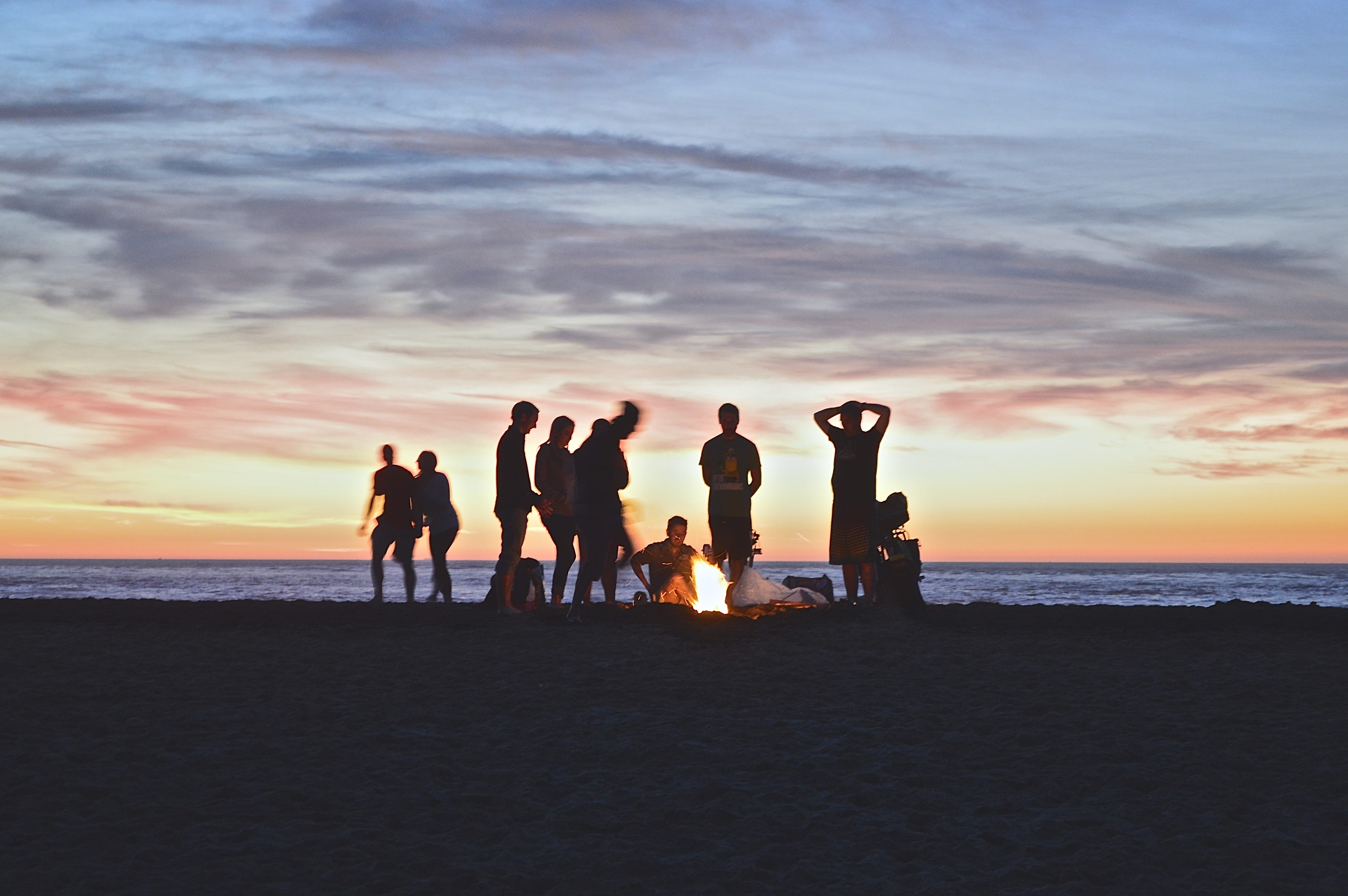 sunset, sand, land, group Of People, back Lit, sky, setting, group, real people, medium group of people, outdoors, bonfire, sea, creating, 4K, campfire, HD Wallpaper