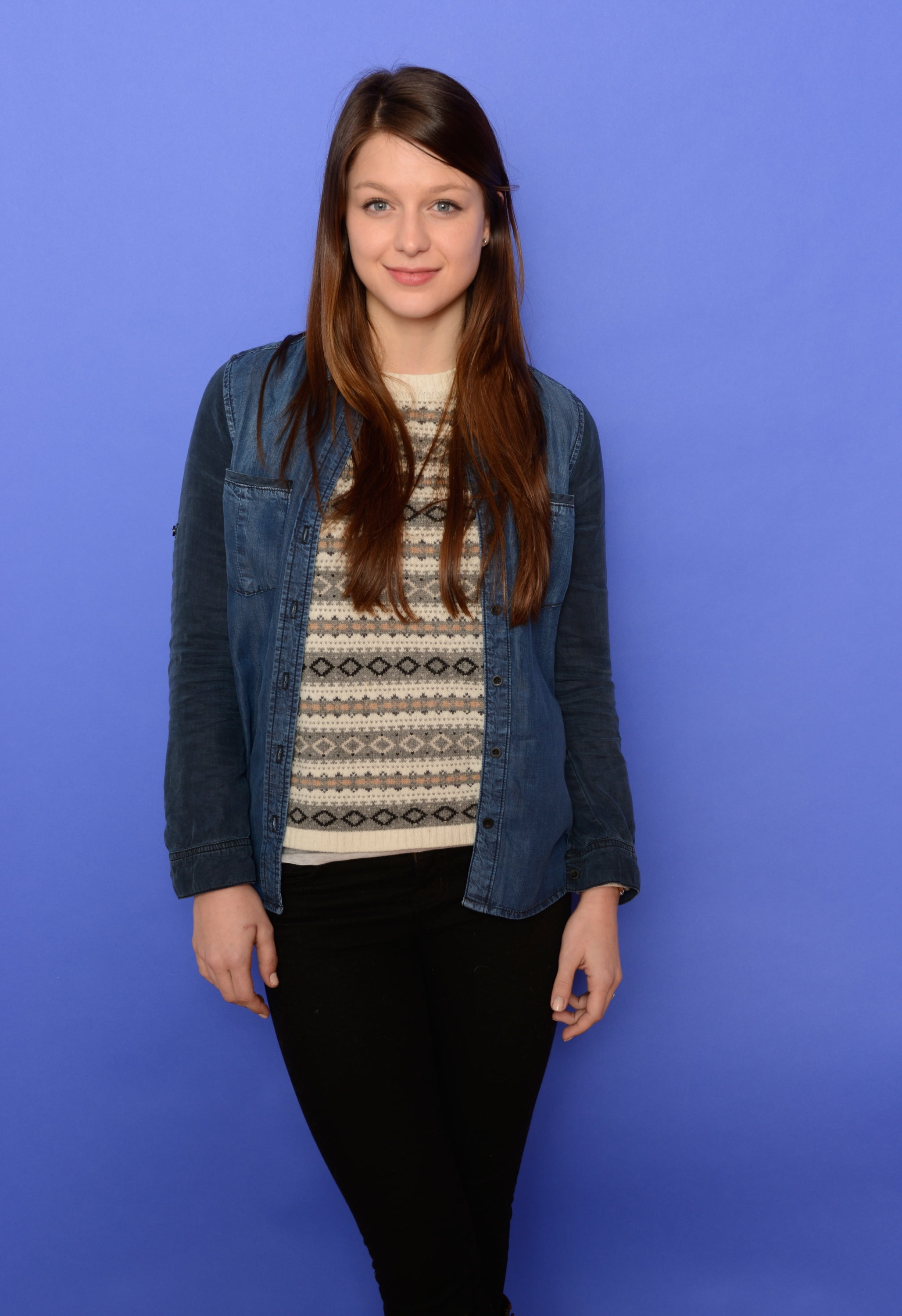 actress, brunette, jean jacket, blue eyes, Melissa Benoist, standing, long hair, smiling, blue background, simple background, portrait display, 2K, Phone HD Wallpaper