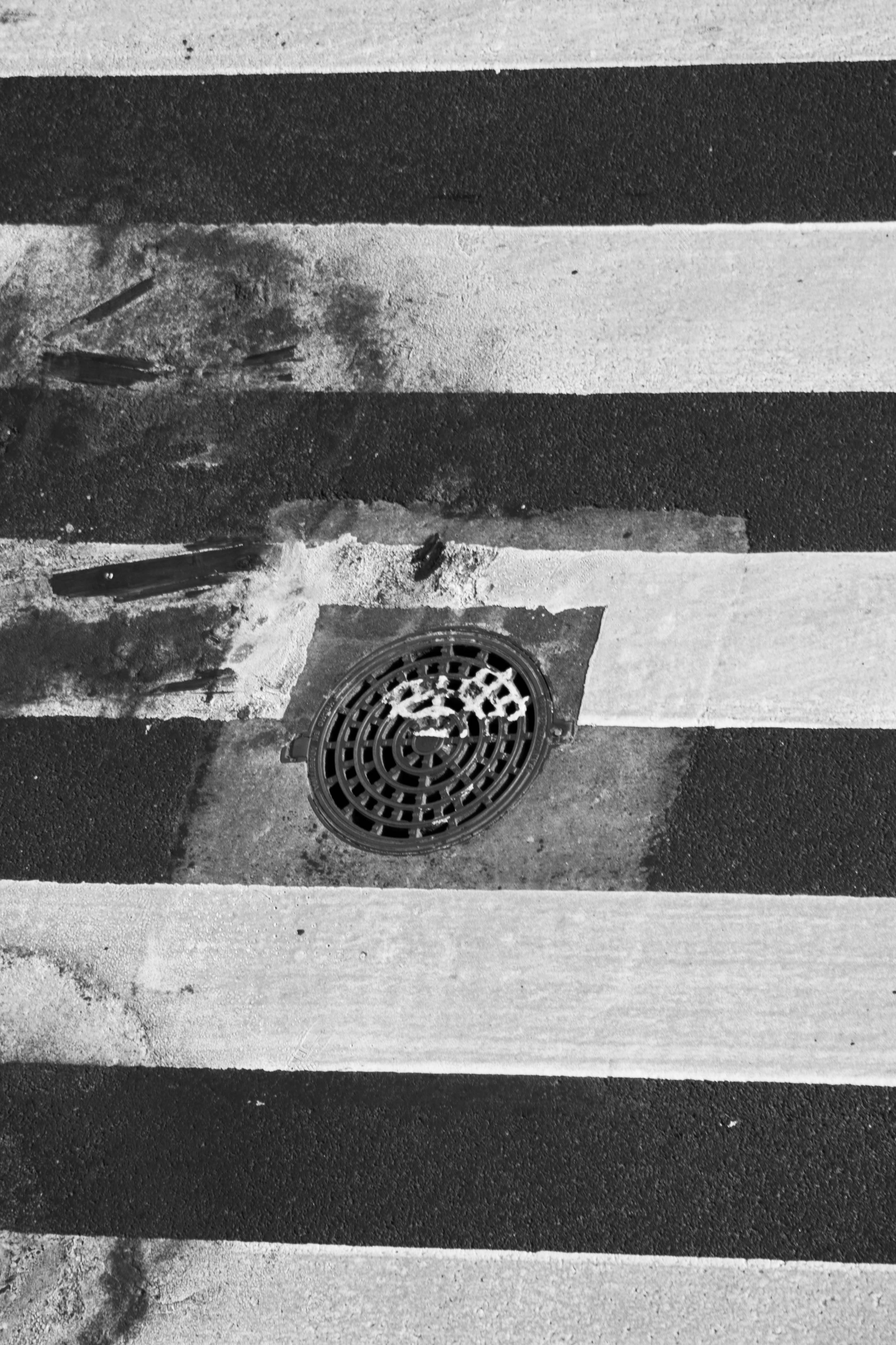 hole, city, sewage, zebra crossing, industrial, drain, grate, no people, road marking, outdoors, road, water, surface, black And White, still life, pattern, Phone HD Wallpaper
