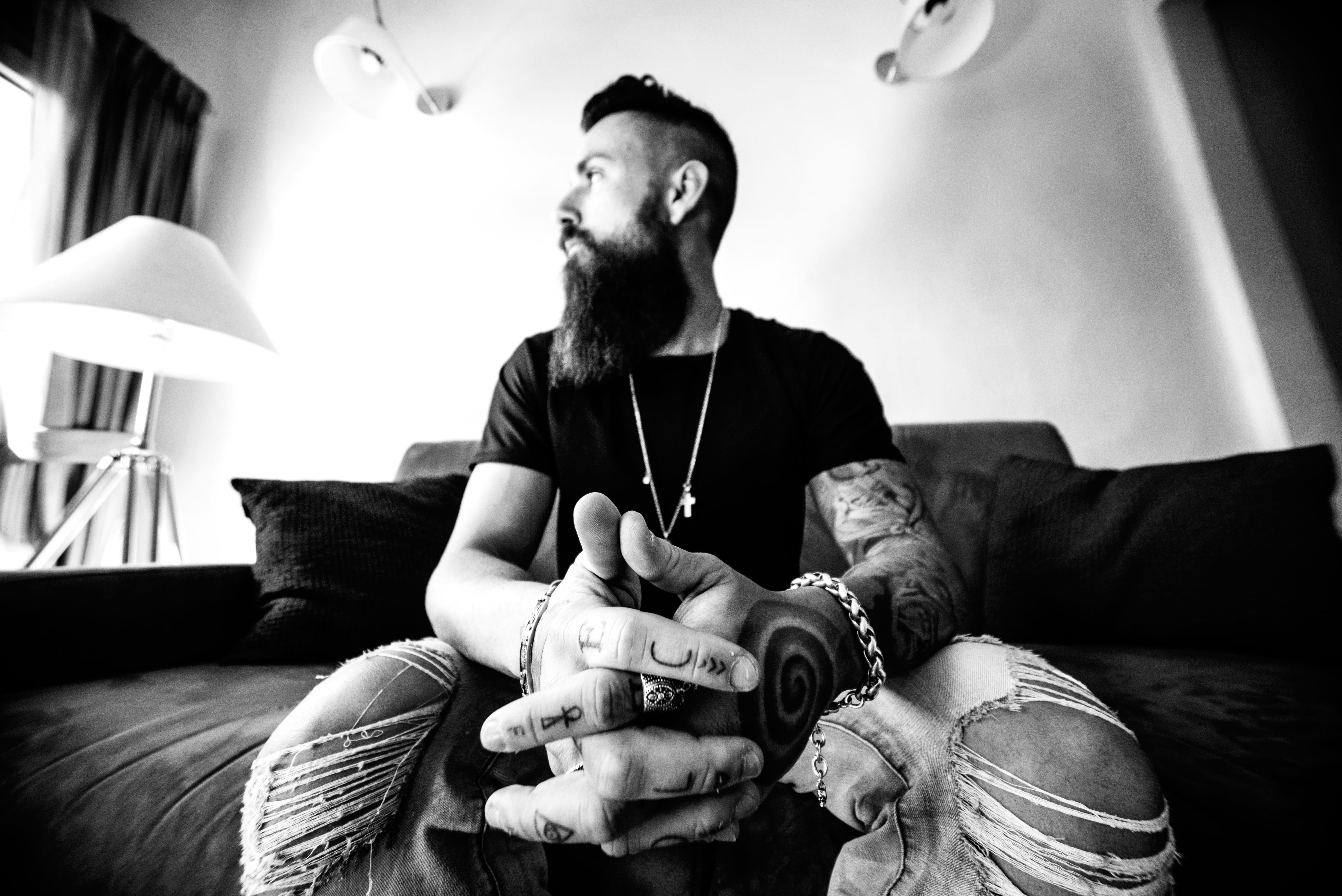 grayscale, living Room, people, facial hair, chair, lighting equipment, domestic room, human hand, men, photography, indoors, tattoo, young men, young Adult, HD Wallpaper