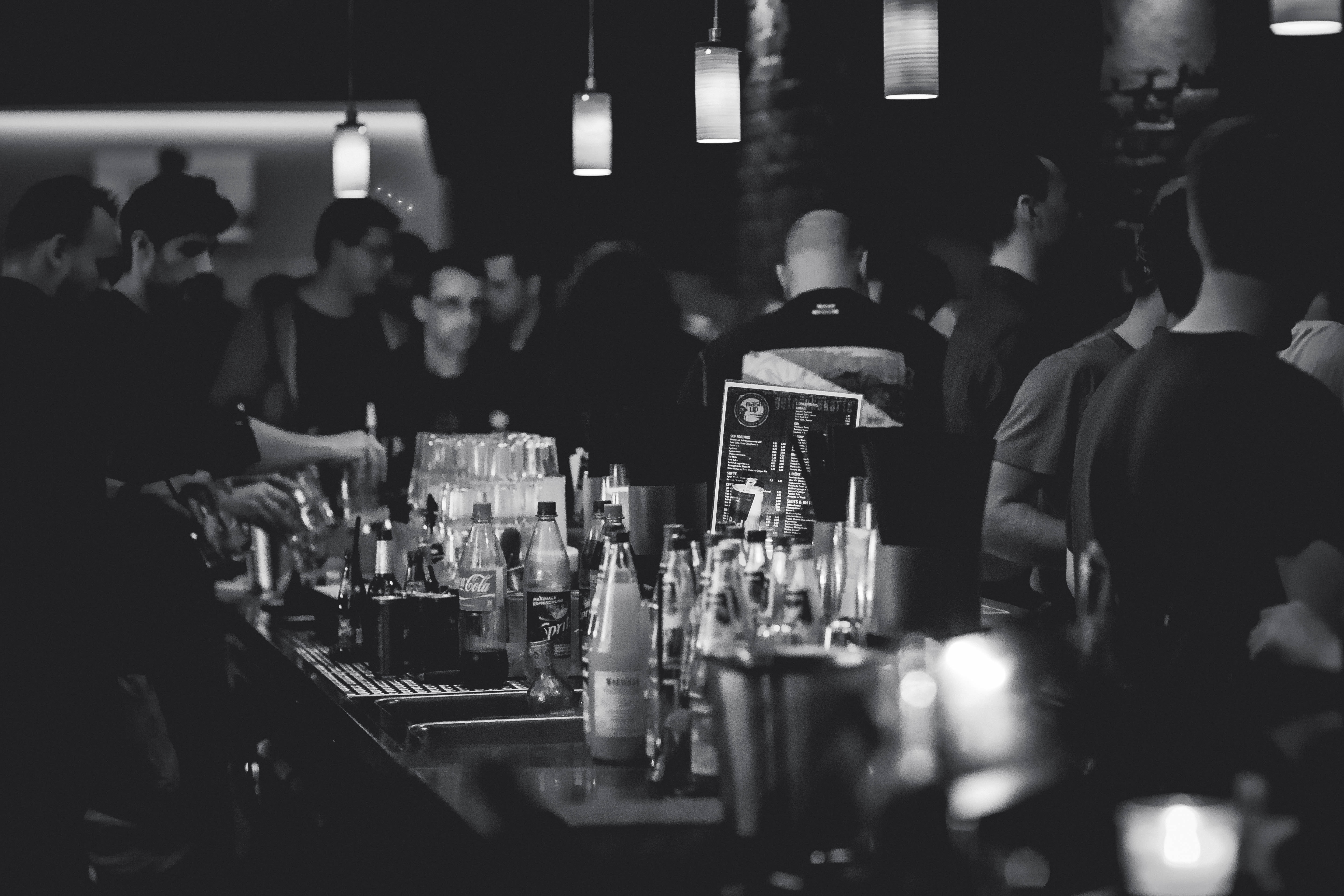 grayscale, night, real people, alcohol, group, adult, group of people, lamps, party, selective focus, people, glass, crowd, night life, club, men, bottle, HD Wallpaper