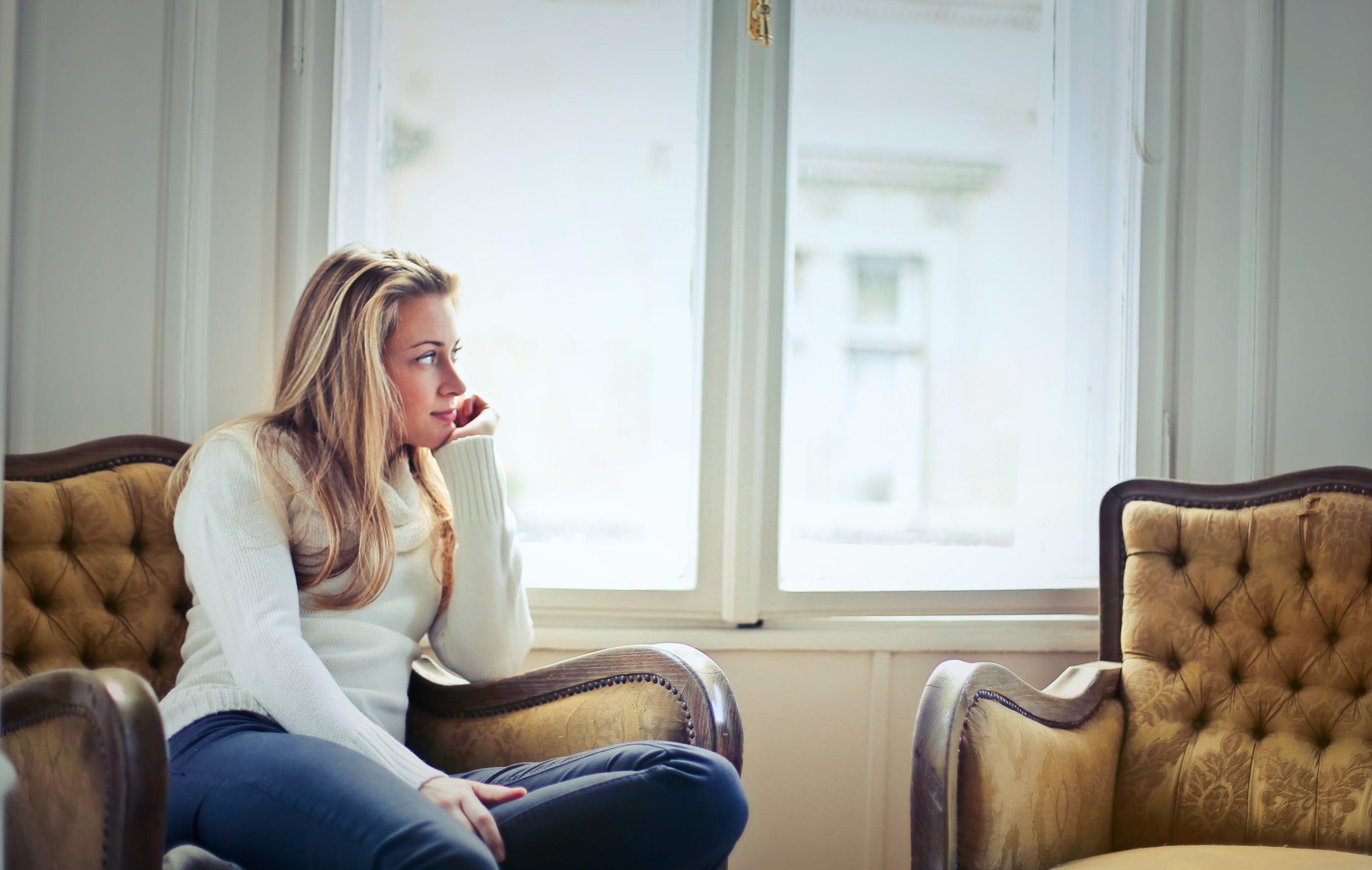 Indoors, chair, armchair, young adult, living room, holidaying, three quarter length, one person, sofa, supporting, young, chin, woman winter girl young home sofa armchair blonde caucas, HD Wallpaper