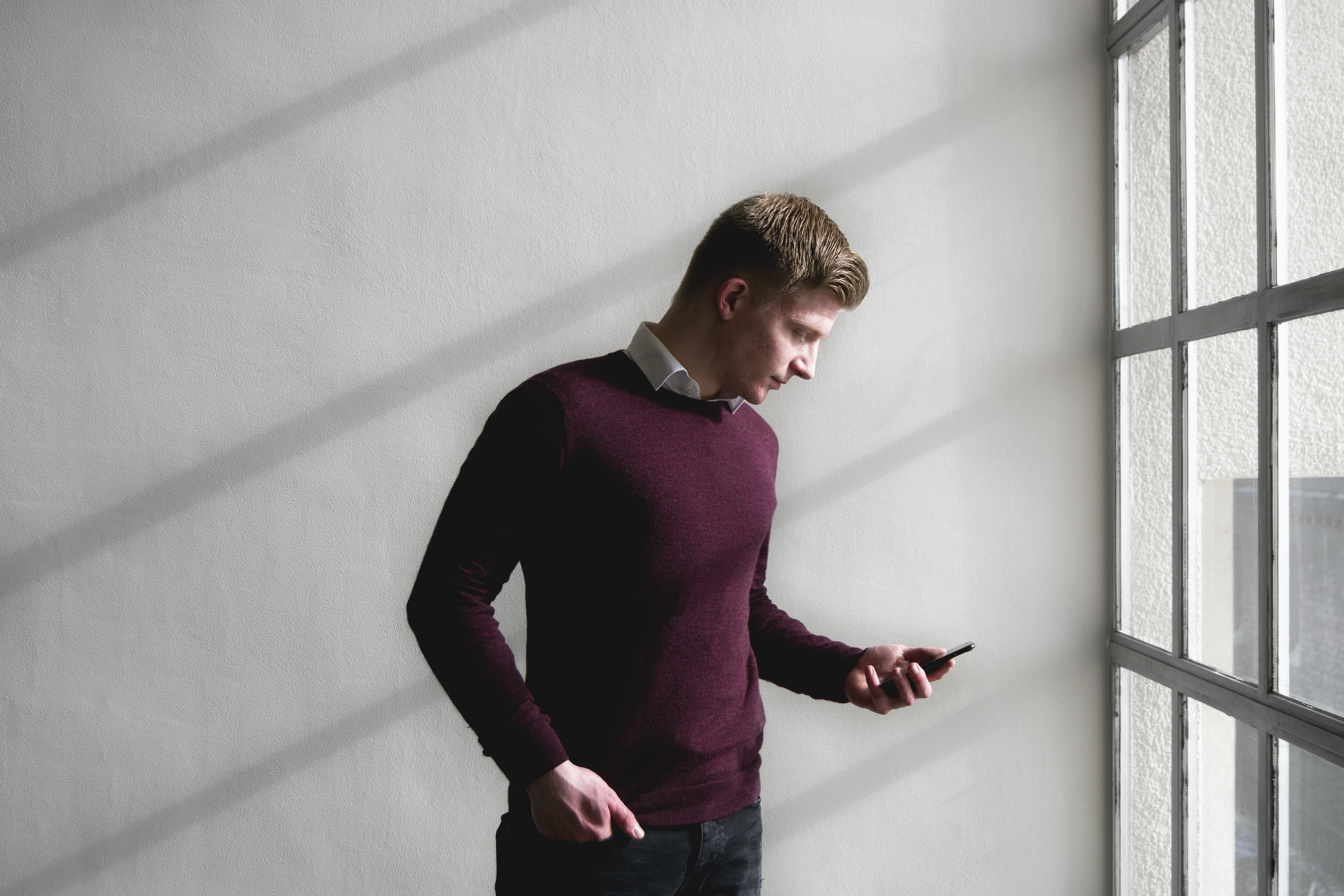 architecture, wall - building feature, casual clothing, holding, portrait, standing, portable information device, looking, man, technology, smartphone, HD Wallpaper